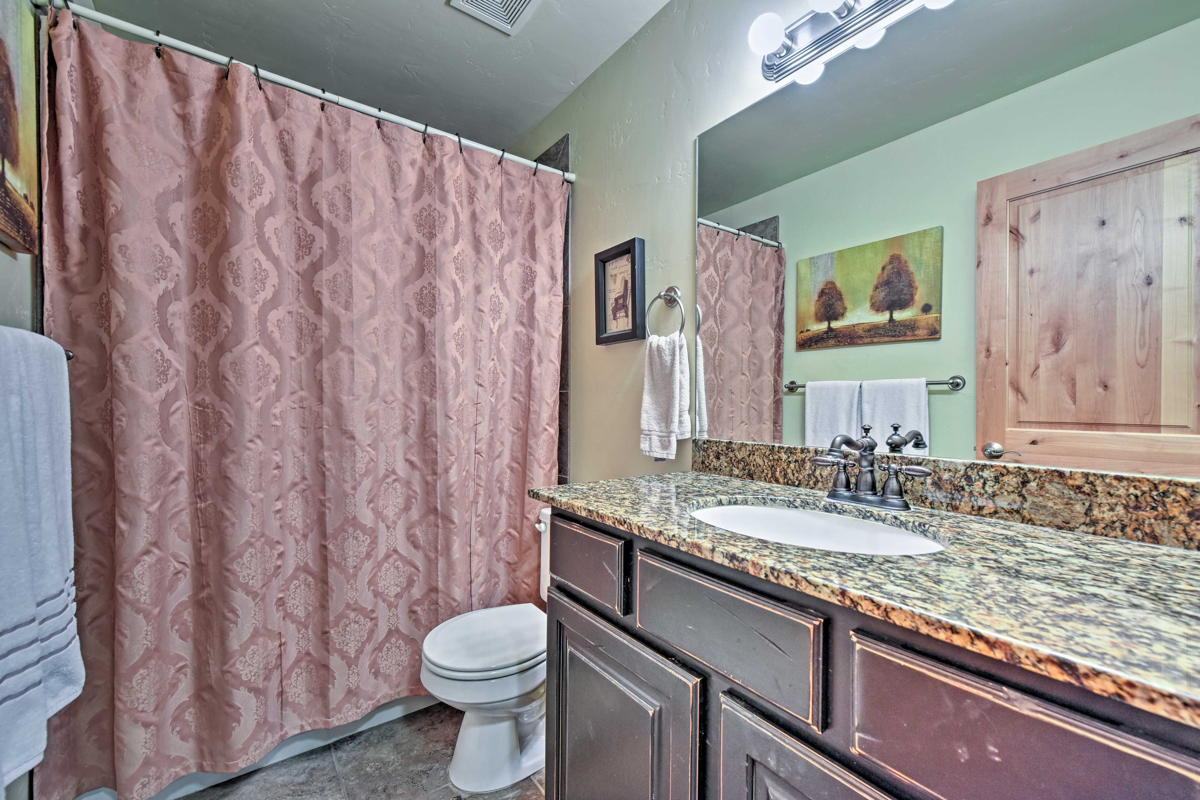 Primp and pamper in this second full bathroom, complete with a tub/shower combo.