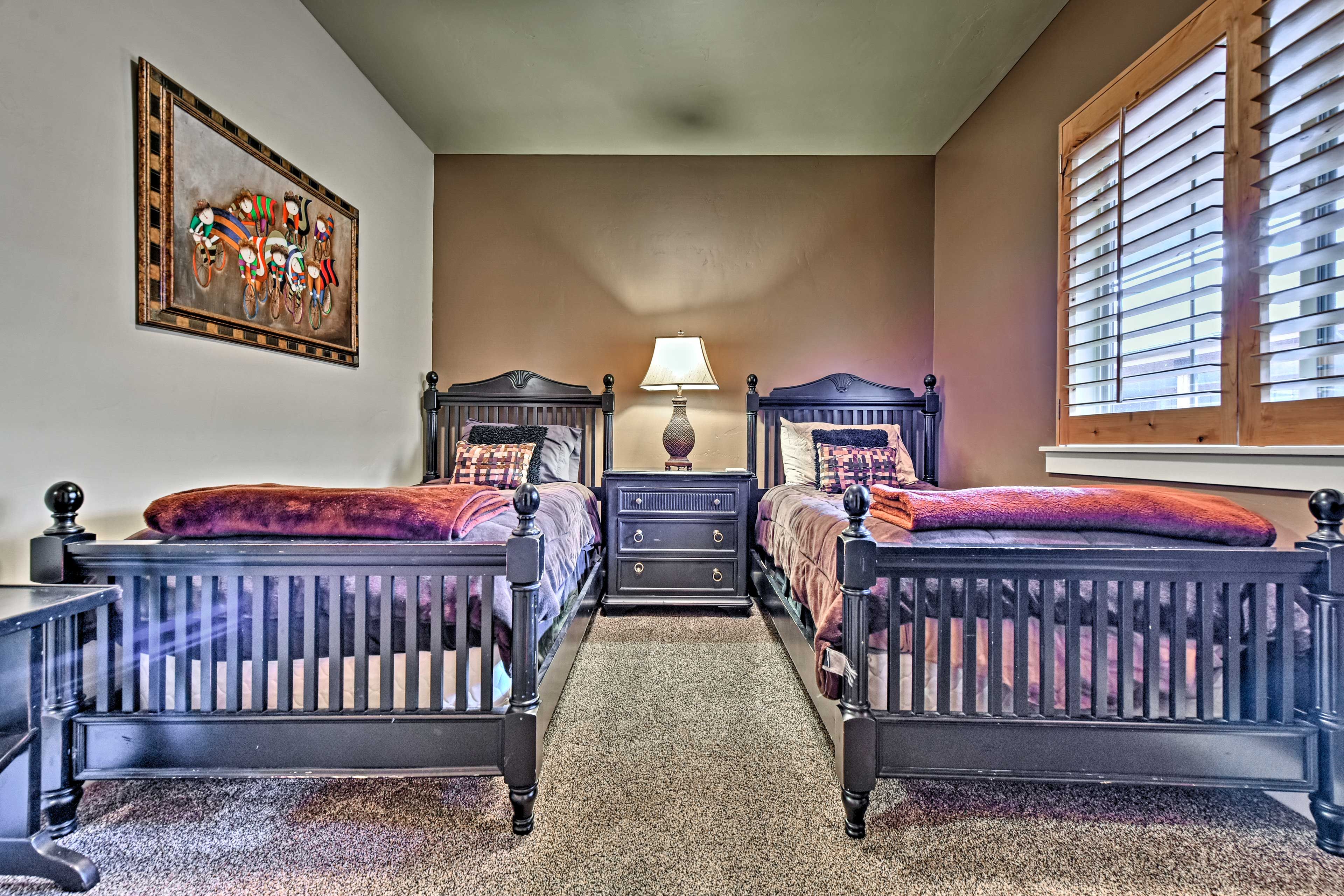 Two will sleep soundly in the third bedroom's 2 twin beds.