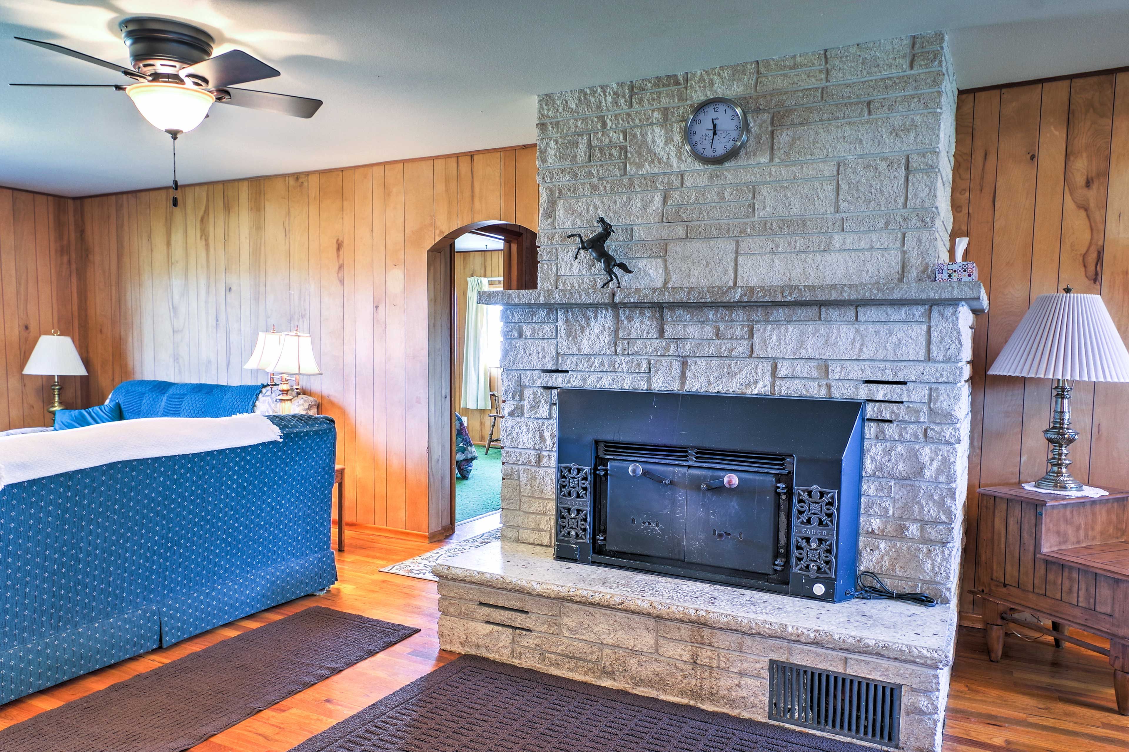 This decorative fireplace creates a charming and cozy ambiance in this earthy abode.