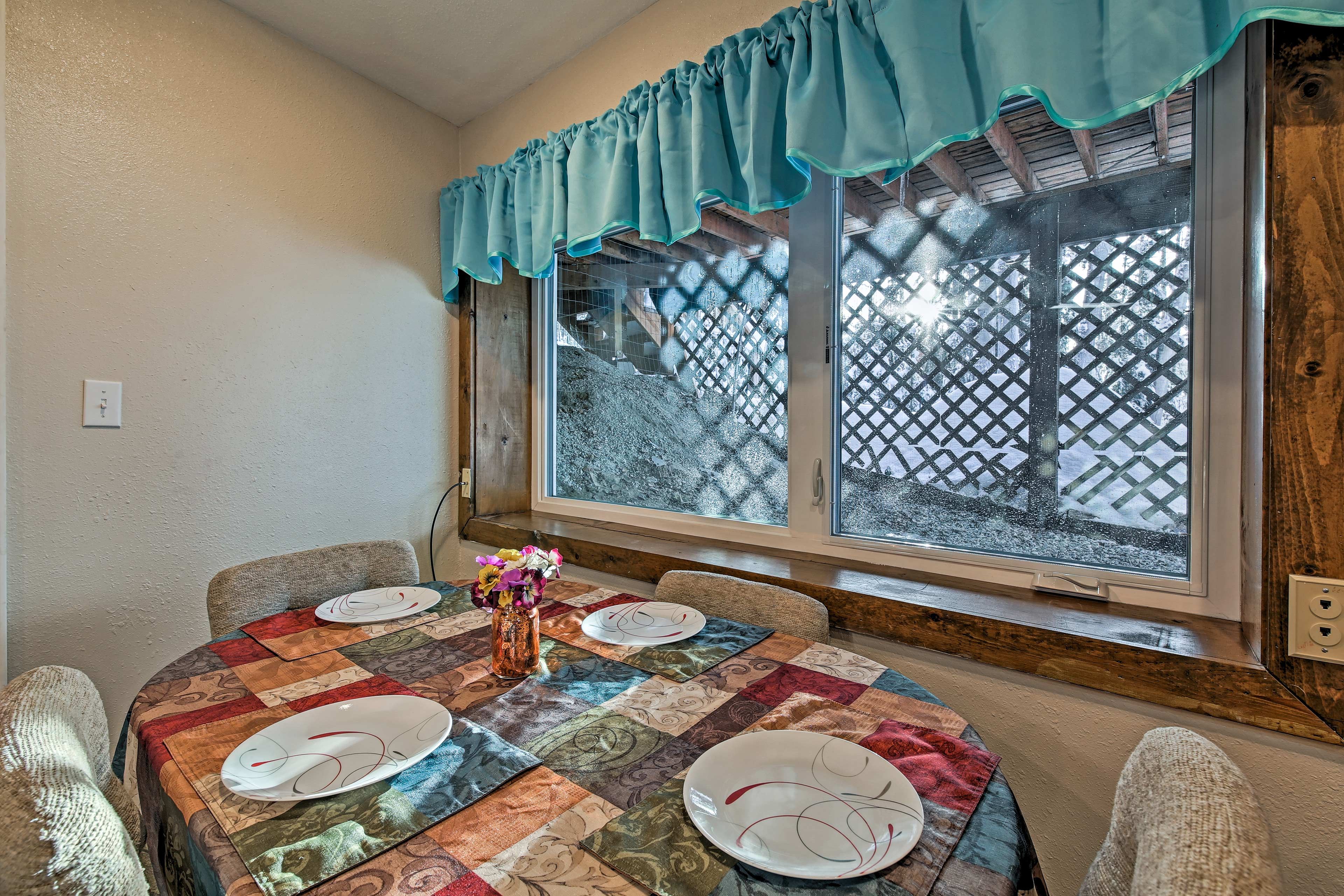 Enjoy your meal at the 4-person dining table.