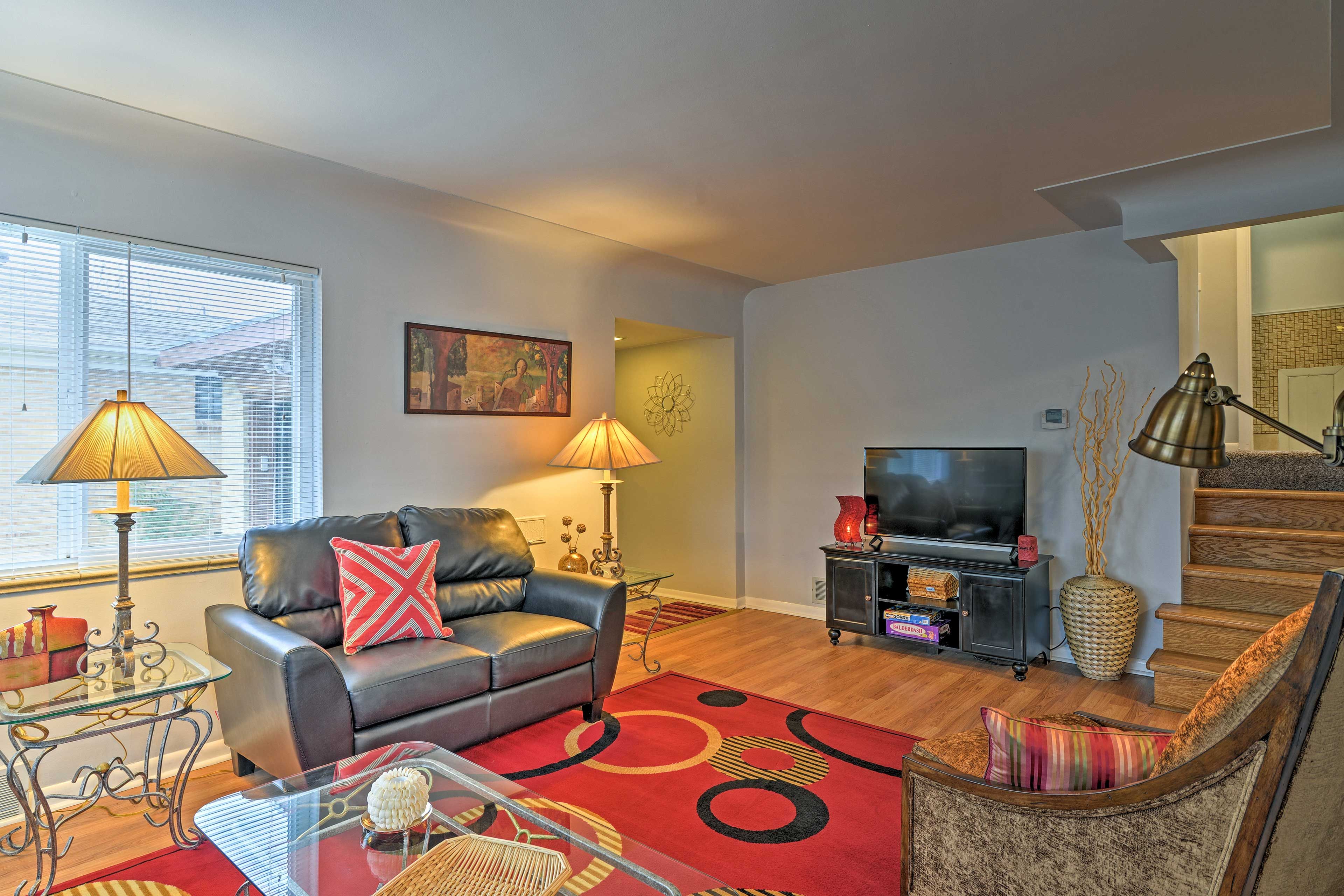 Relax on the leather furniture in the living room and watch a movie on the TV.