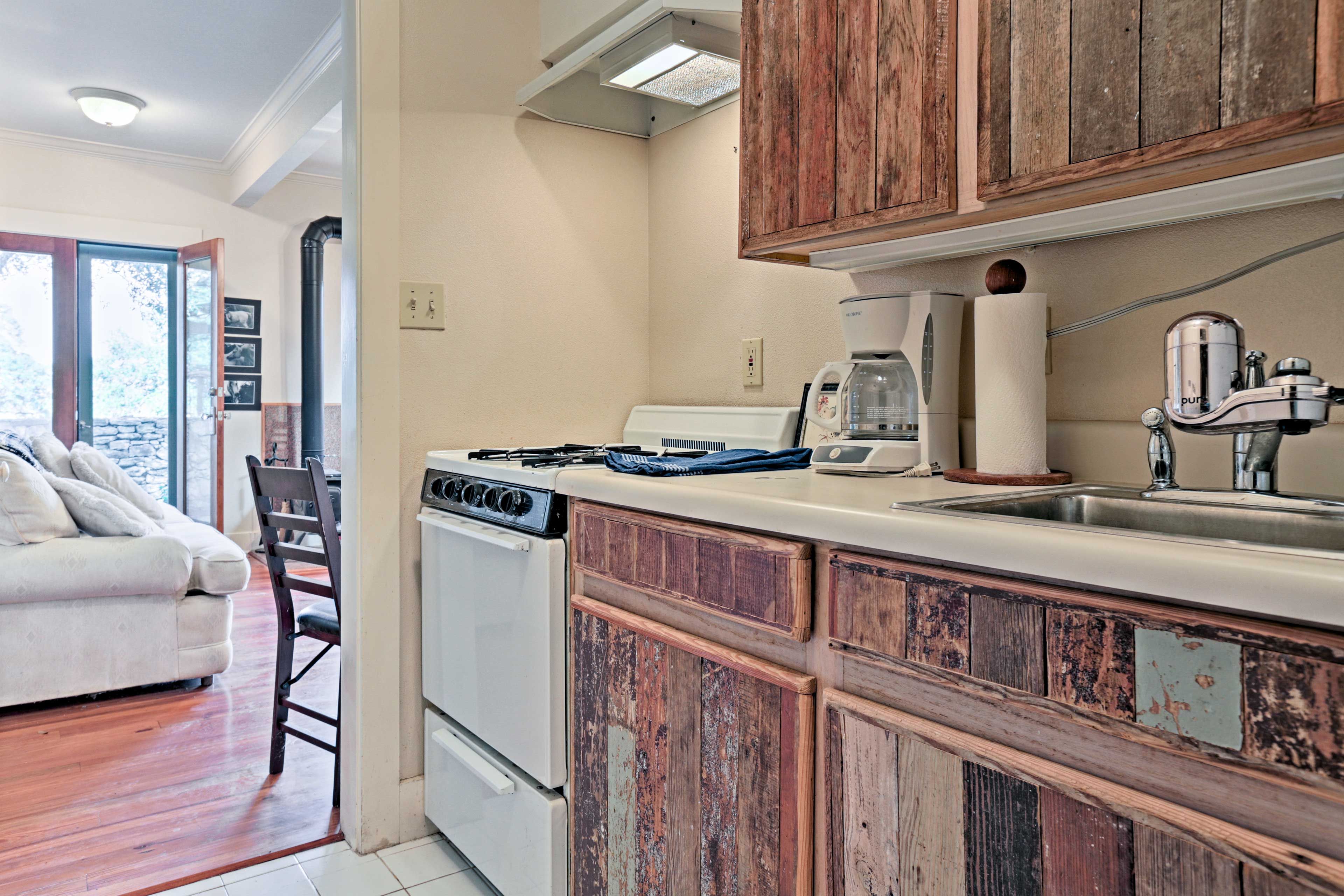 Prepare small meals in the galley kitchen adjacent to the living room.