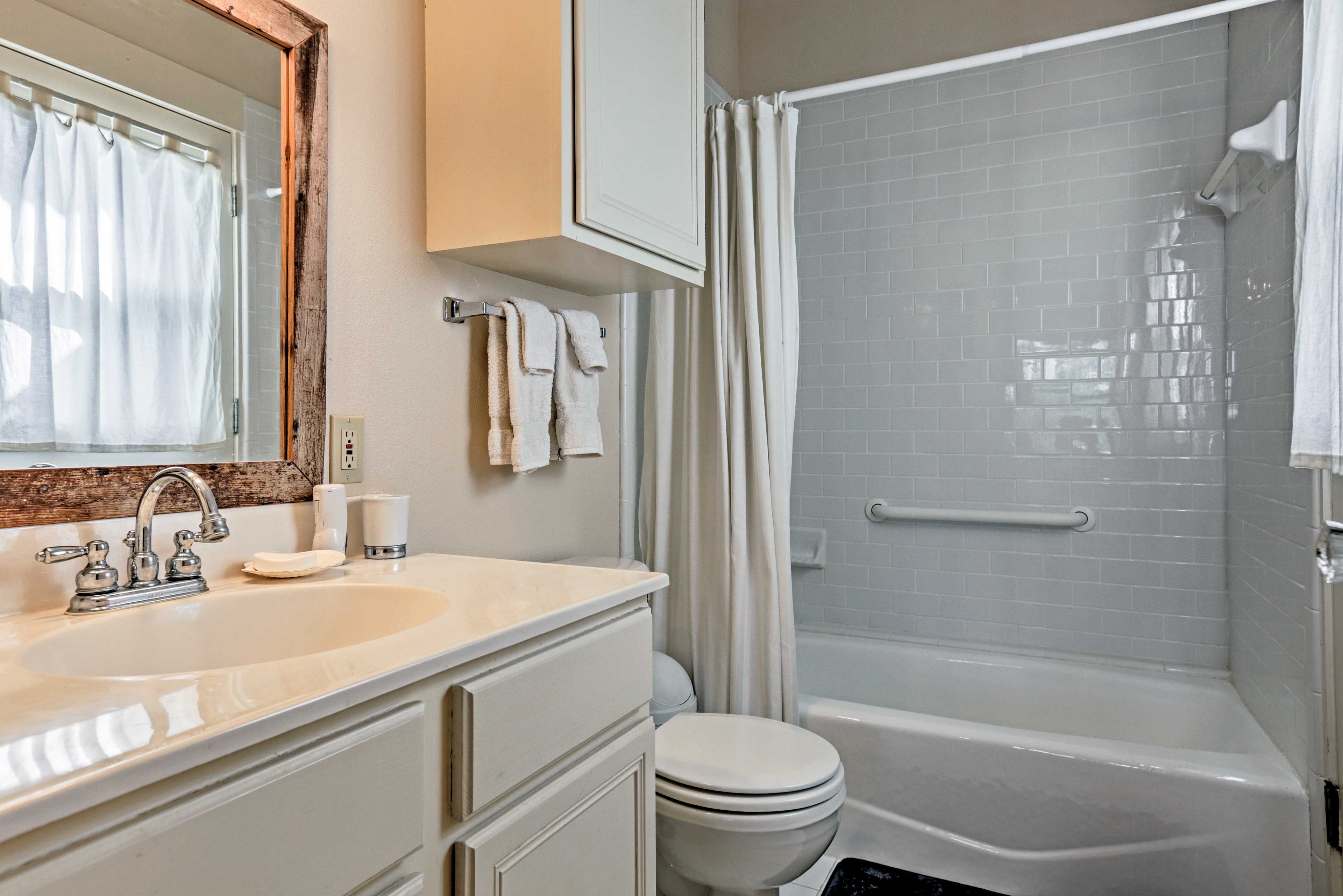 Utilize the shower/tub combo & single vanity sink found in the second bathroom.