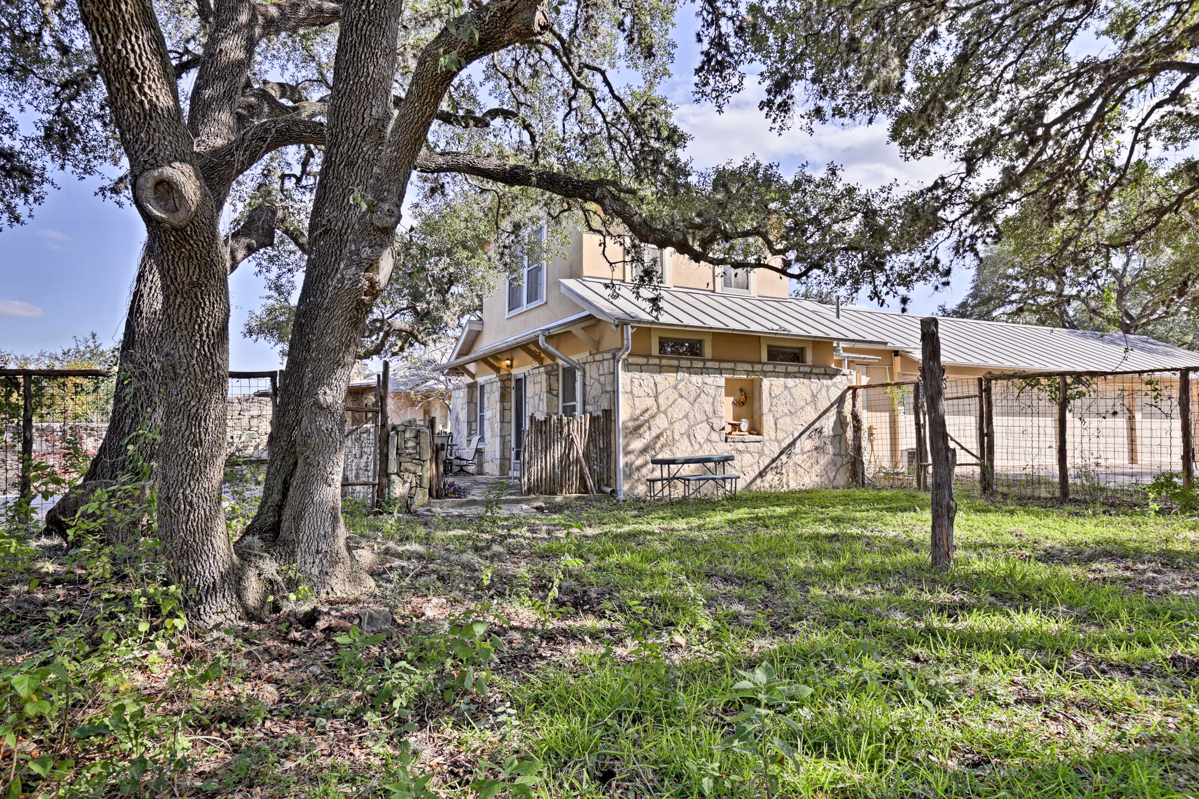 This home offers a beautiful yard space with luxurious shared amenities.