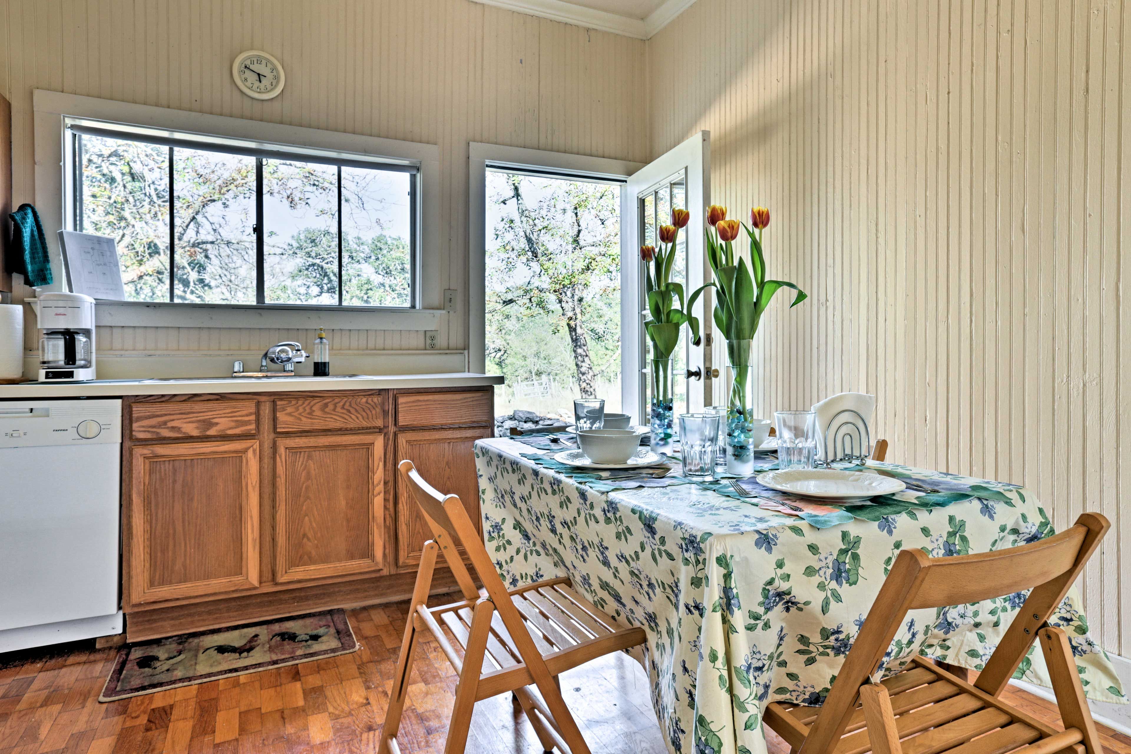 The table is conveniently located next to the kitchen.