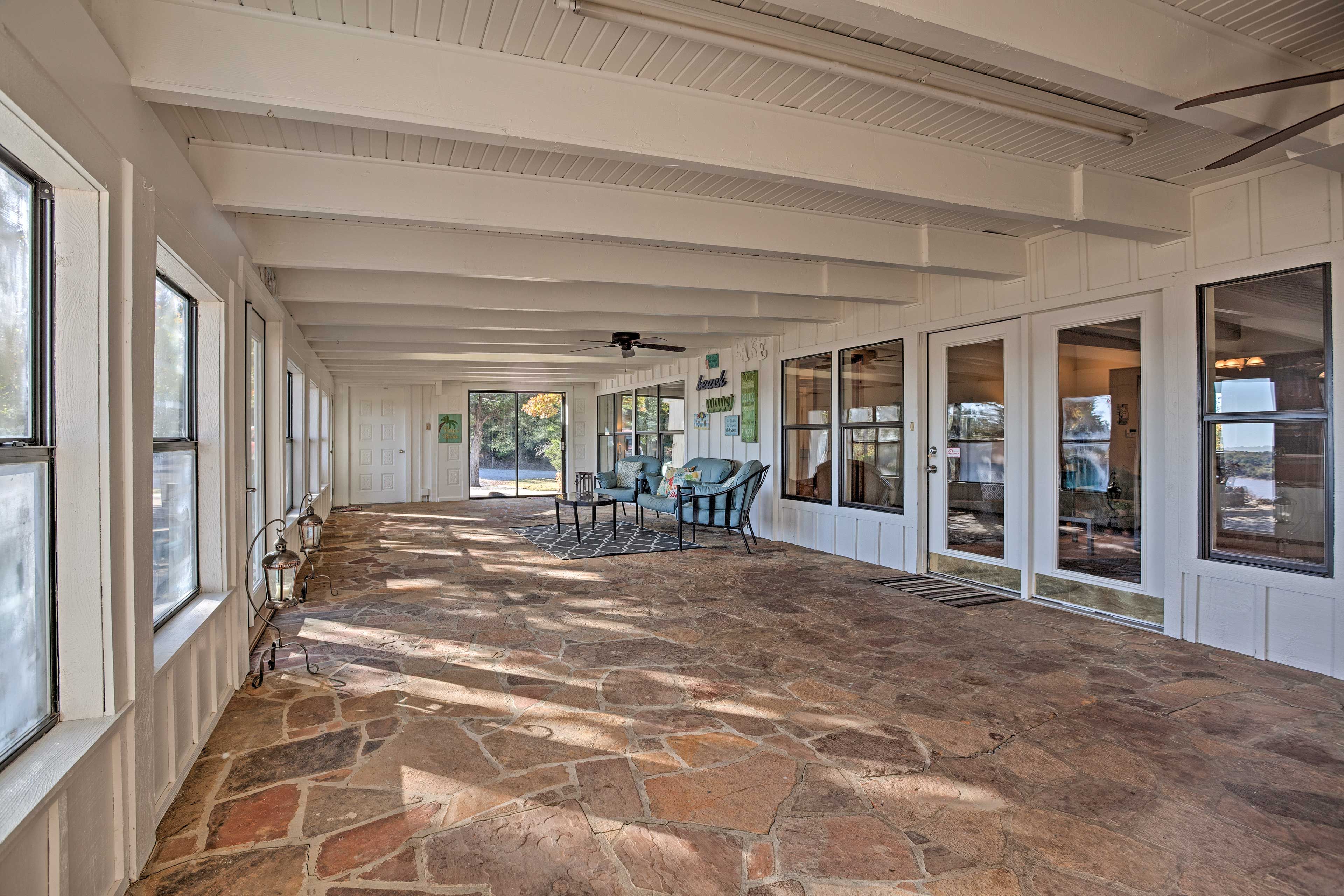 This charming sunroom is the perfect place to enjoy an afternoon cocktail.