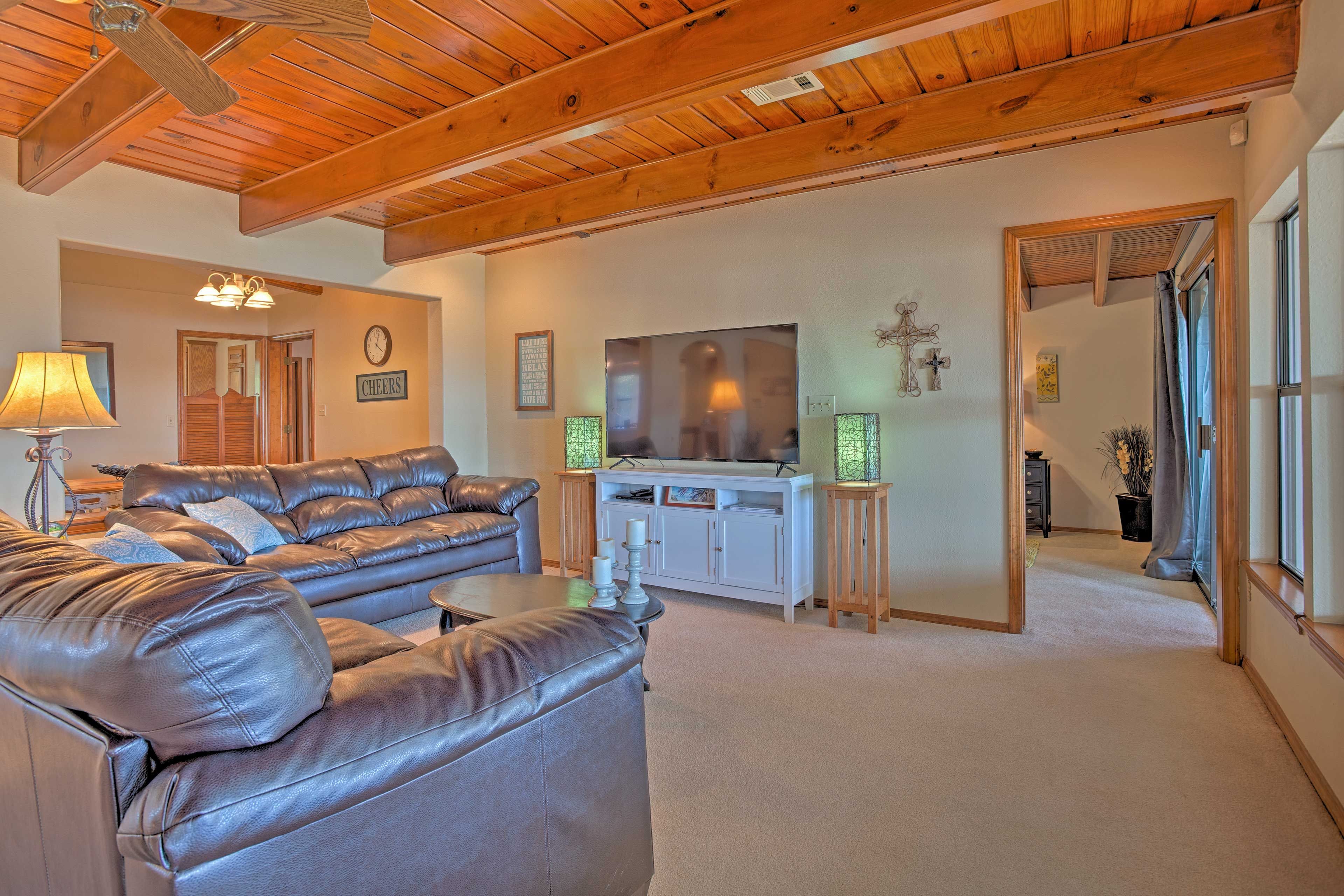 You'll love taking afternoon naps on these 2 leather couches.