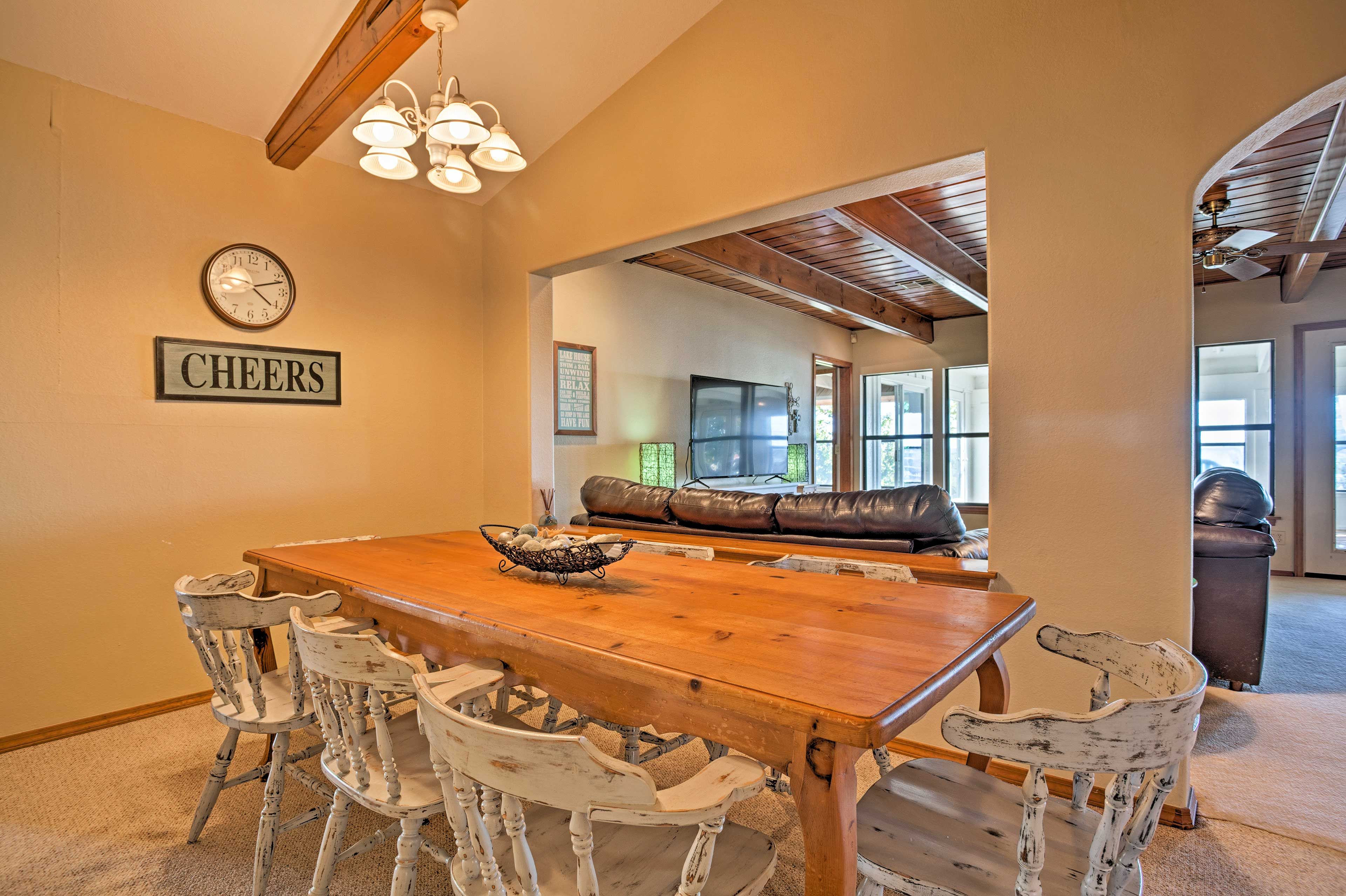 Gather for a savory meal around this 8-person dining table.