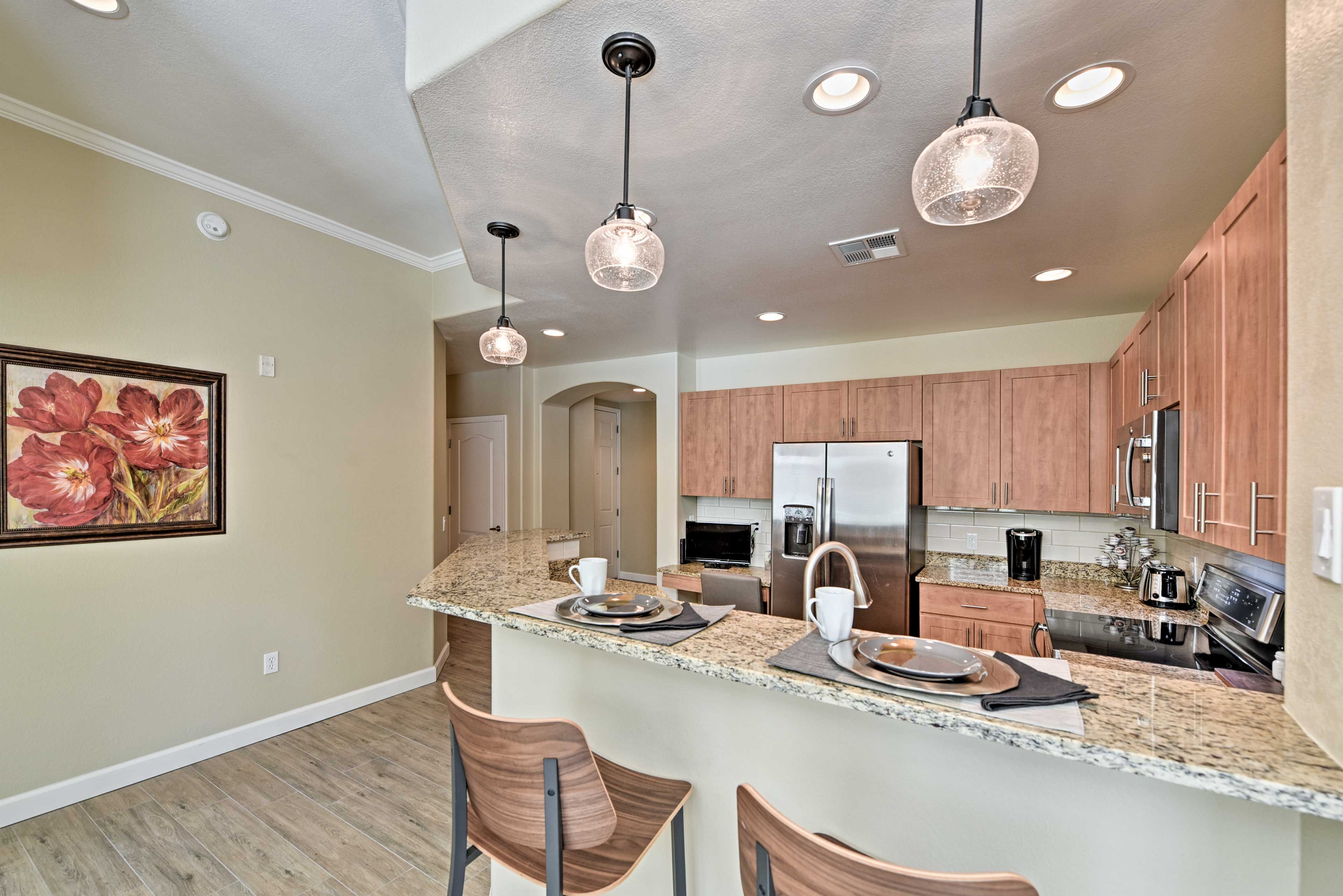 Pull up a chair to the kitchen peninsula to keep the chef company!