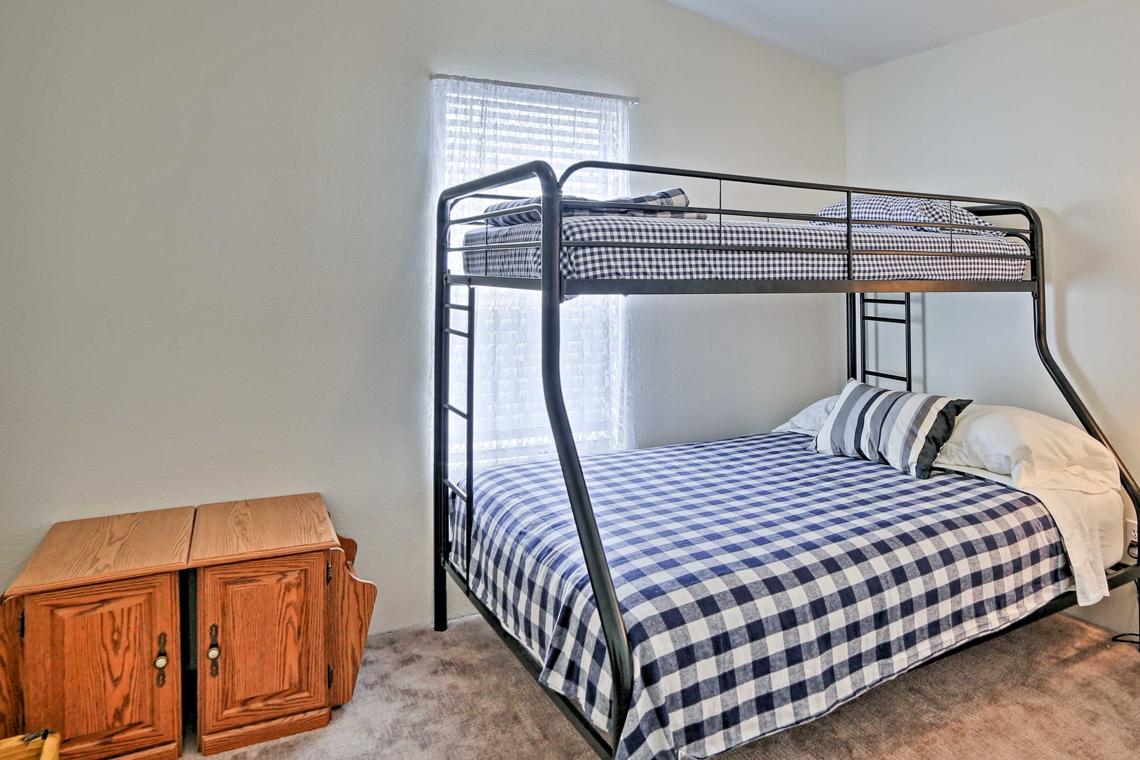 This bedroom offers a twin/full bunk bed.