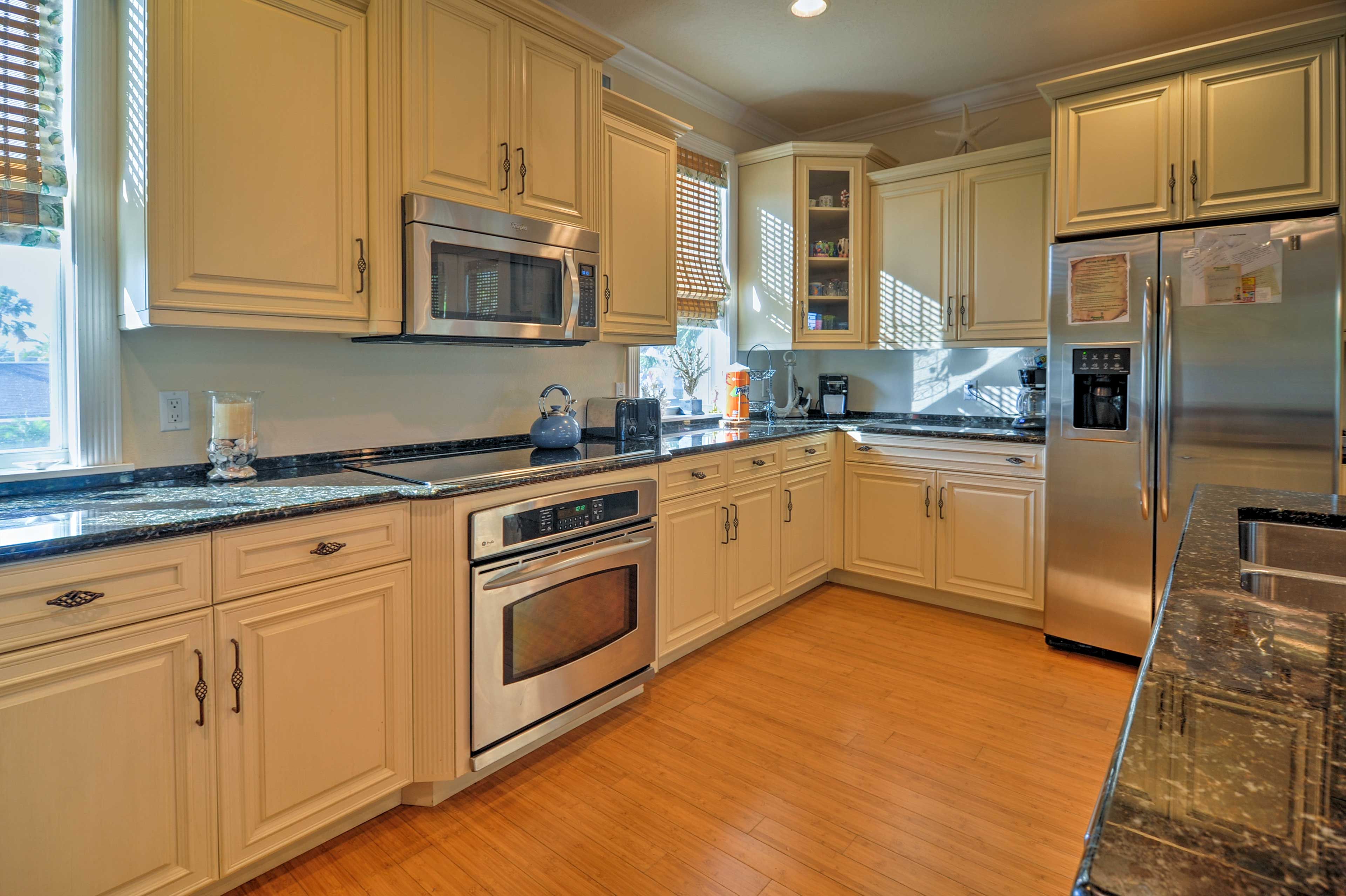 Fully equipped with GE and Bosch appliances, this kitchen is sure to satisfy any chef!