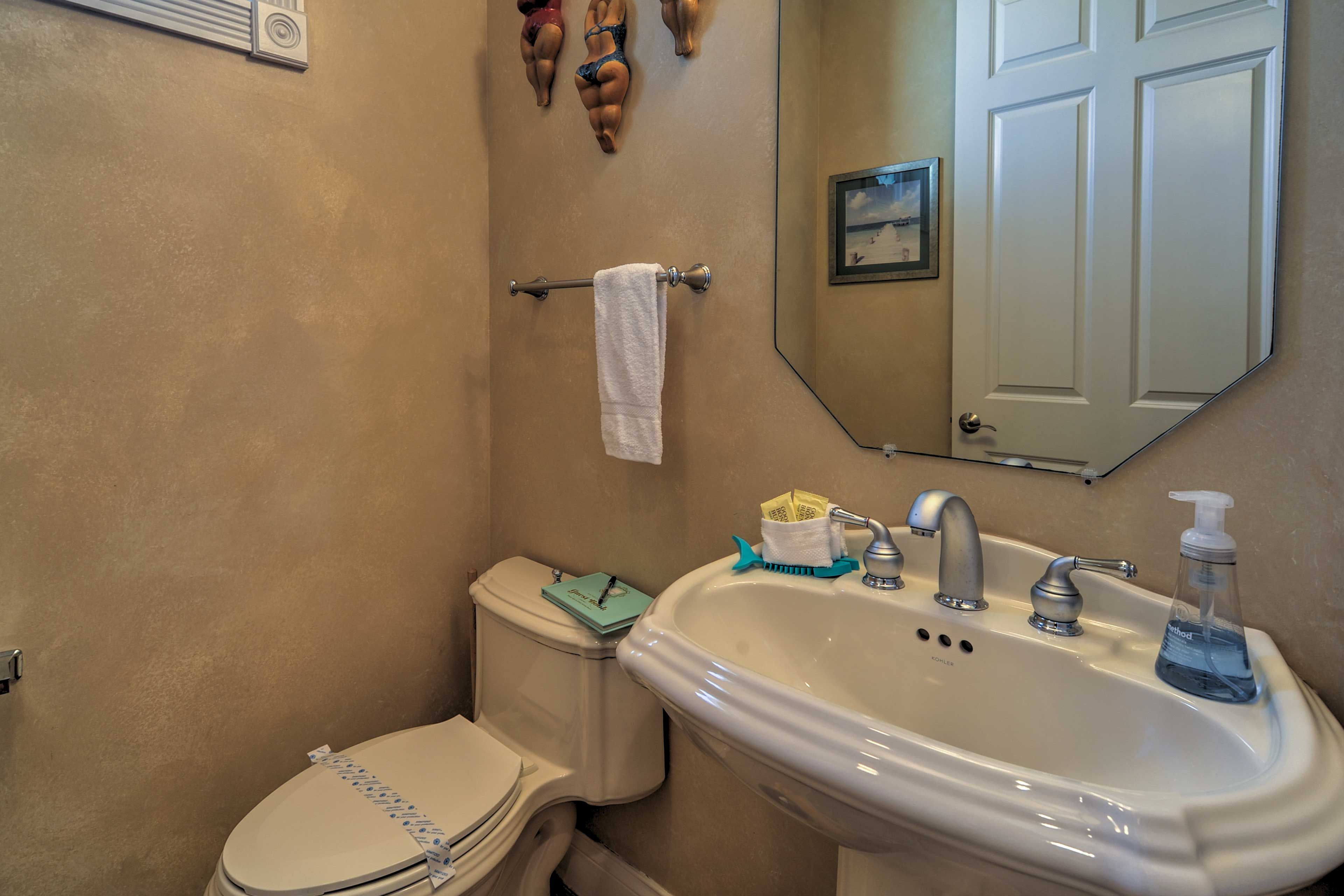 Freshen up in this half bathroom.