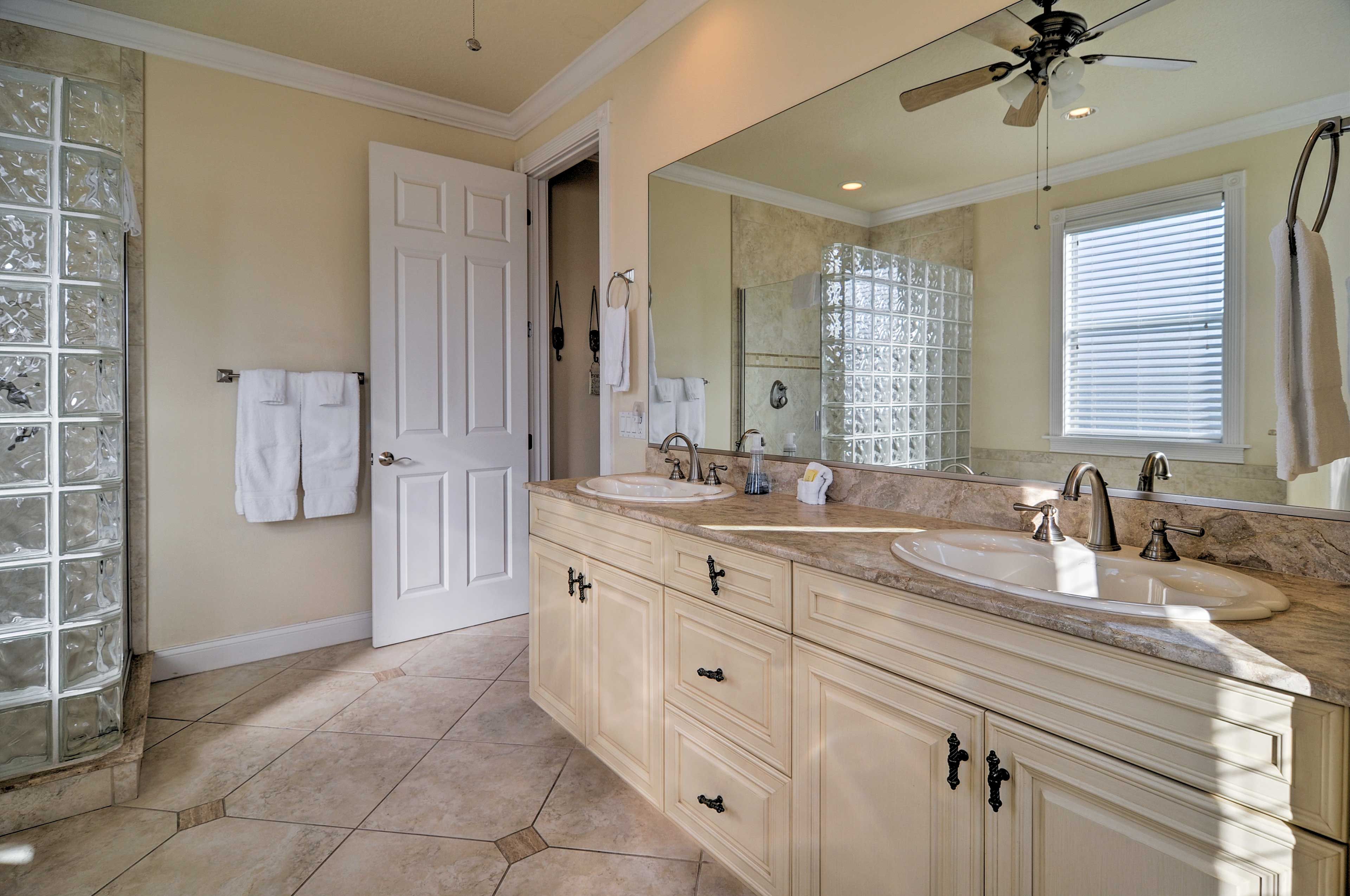 Primp and pamper in this full en-suite bathroom.