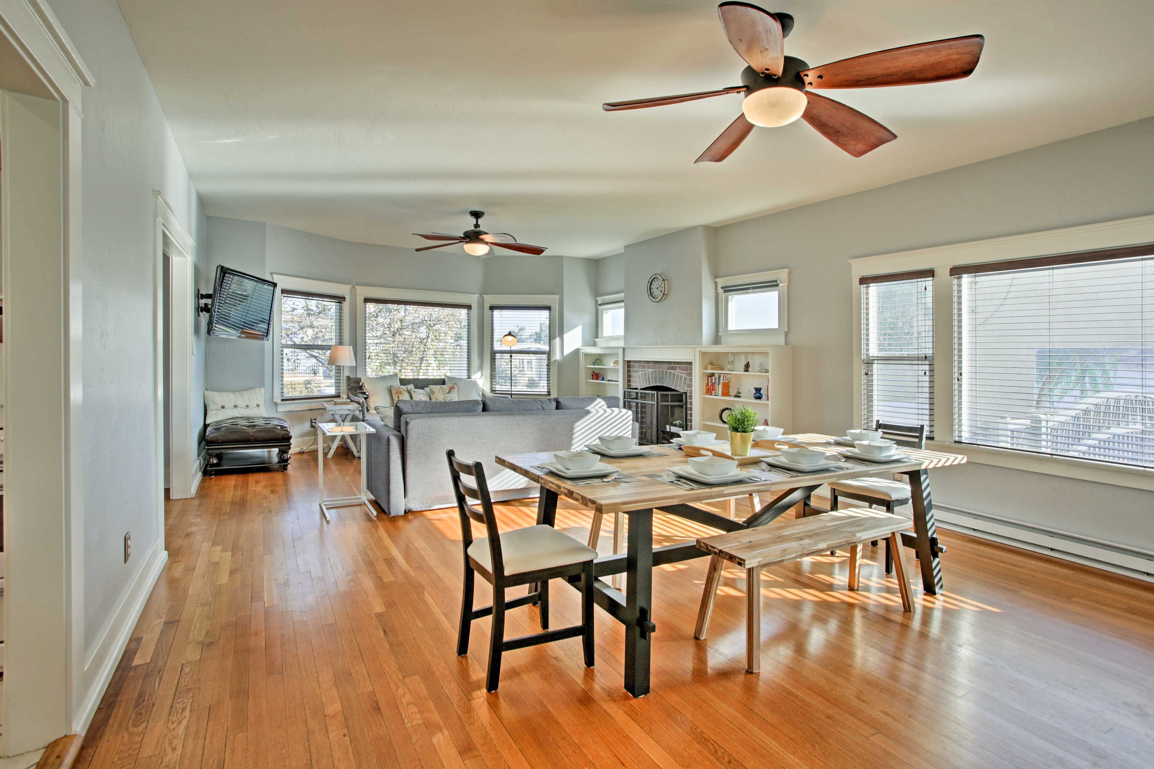 An expansive 8-person dining table provides ample space to eat.