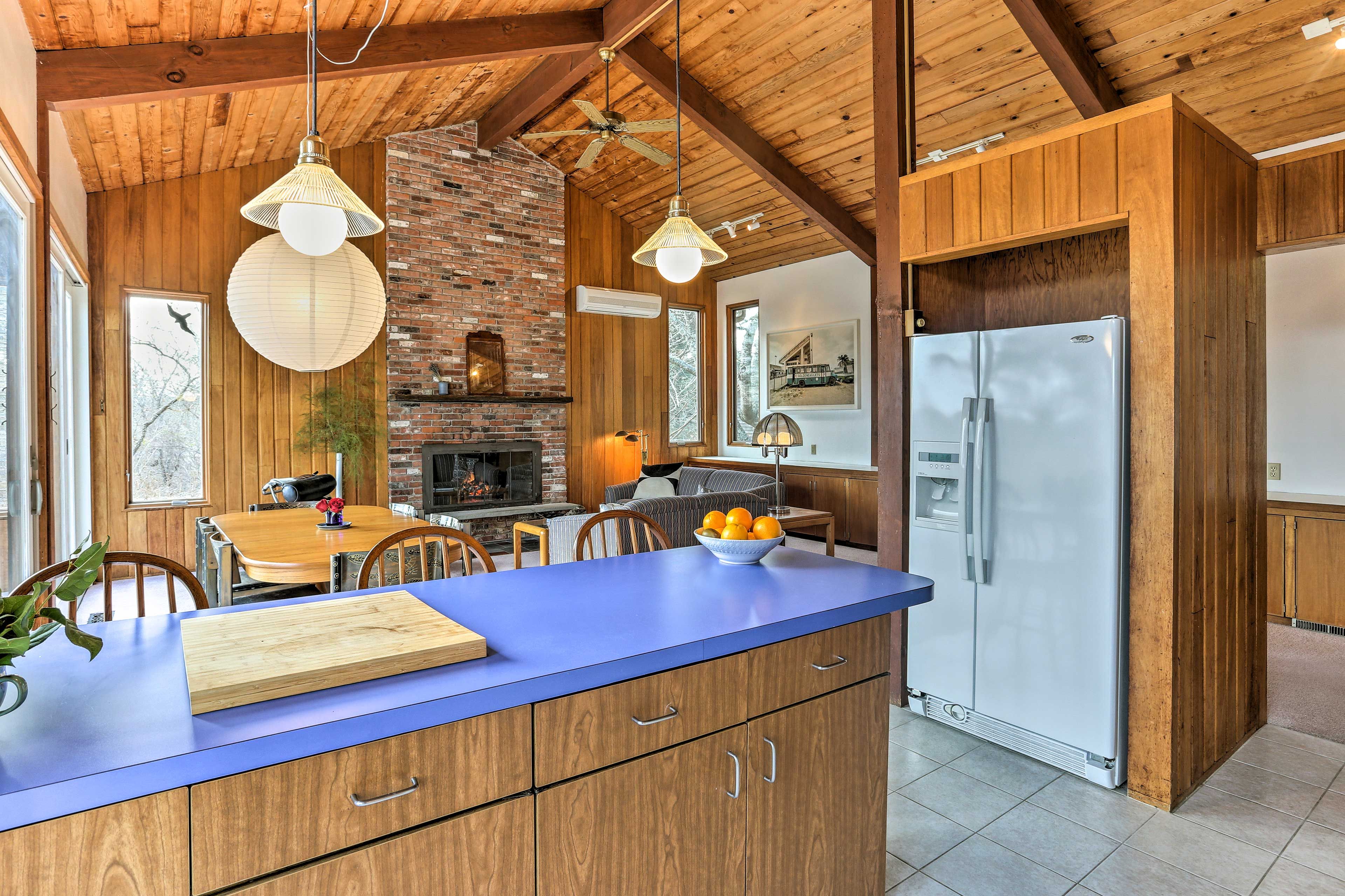 Enjoy appetizers and drinks at the kitchen's breakfast bar.