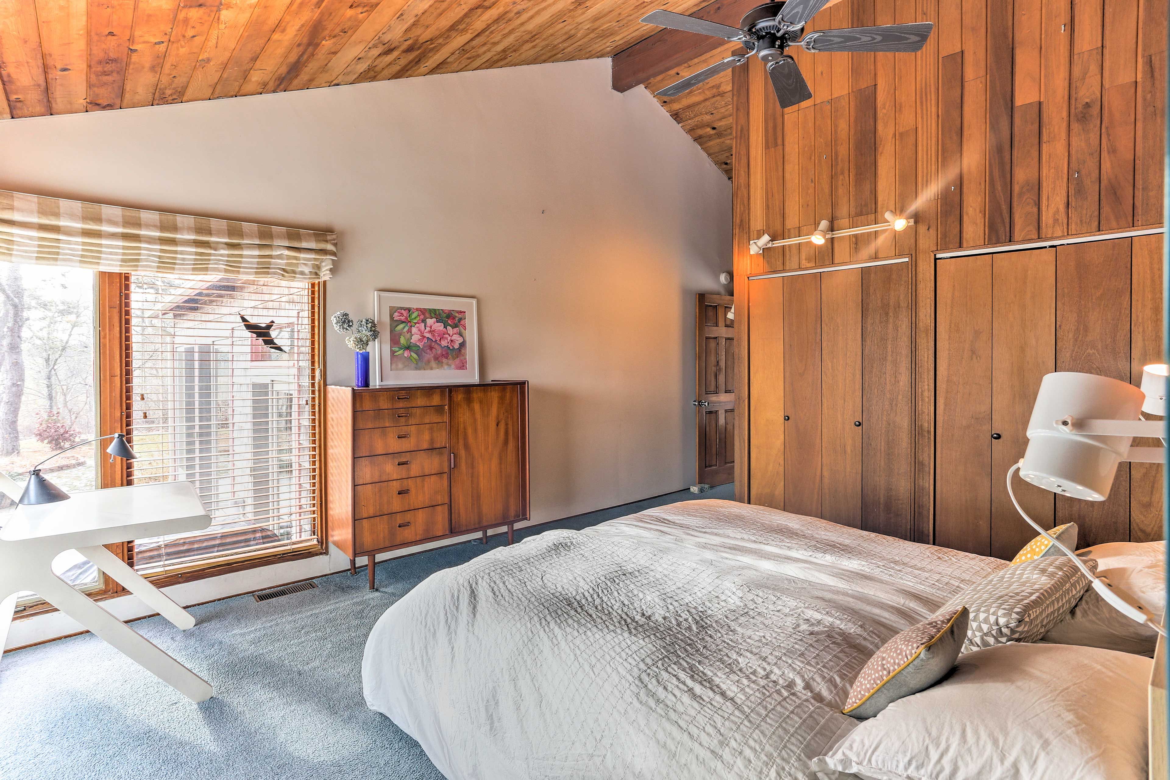 Each bedroom features a sliding glass door that opens to the wraparound deck.
