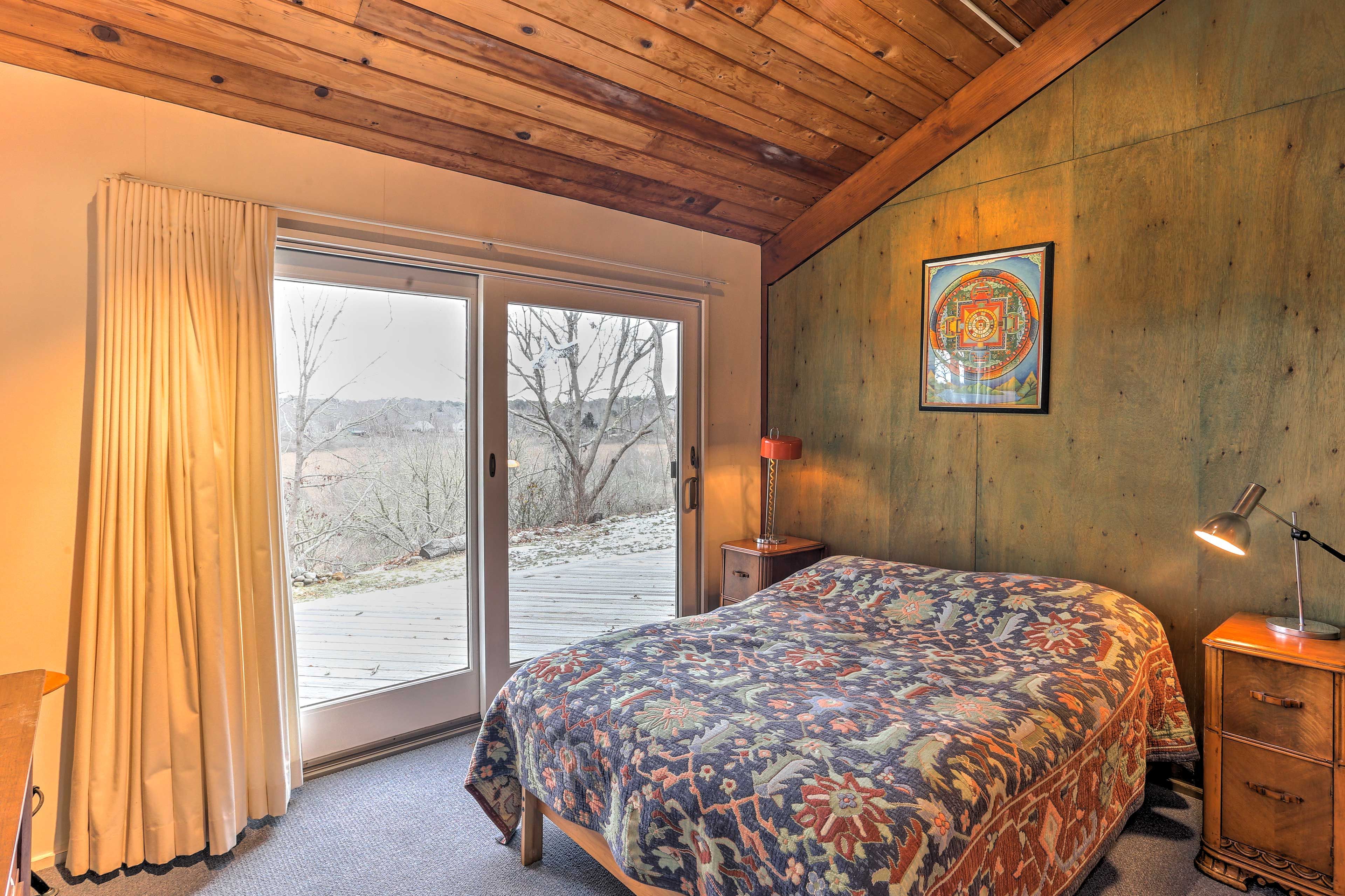 This bedroom offers a plush queen bed.