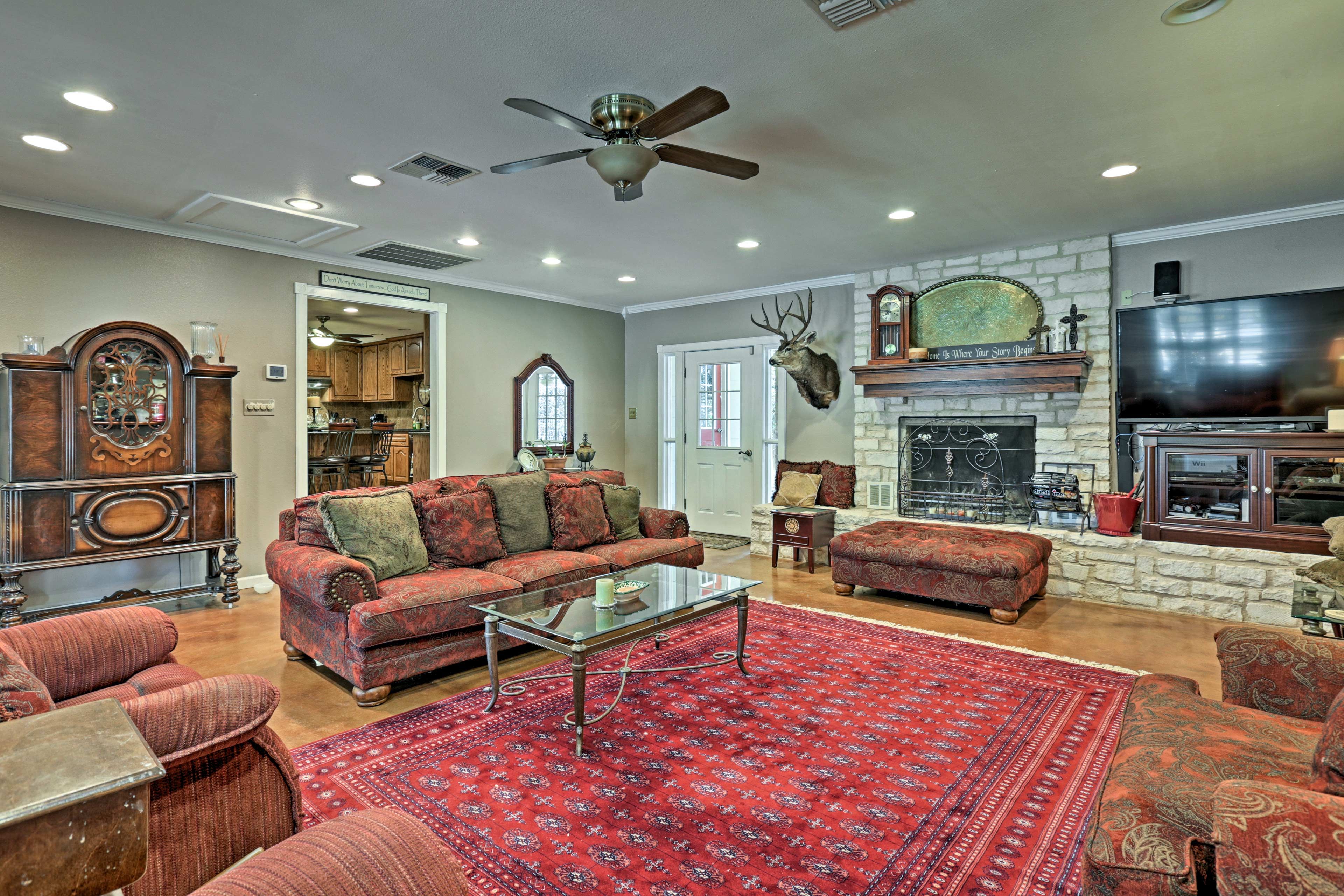 The large living room features traditional decor and cozy furnishings.