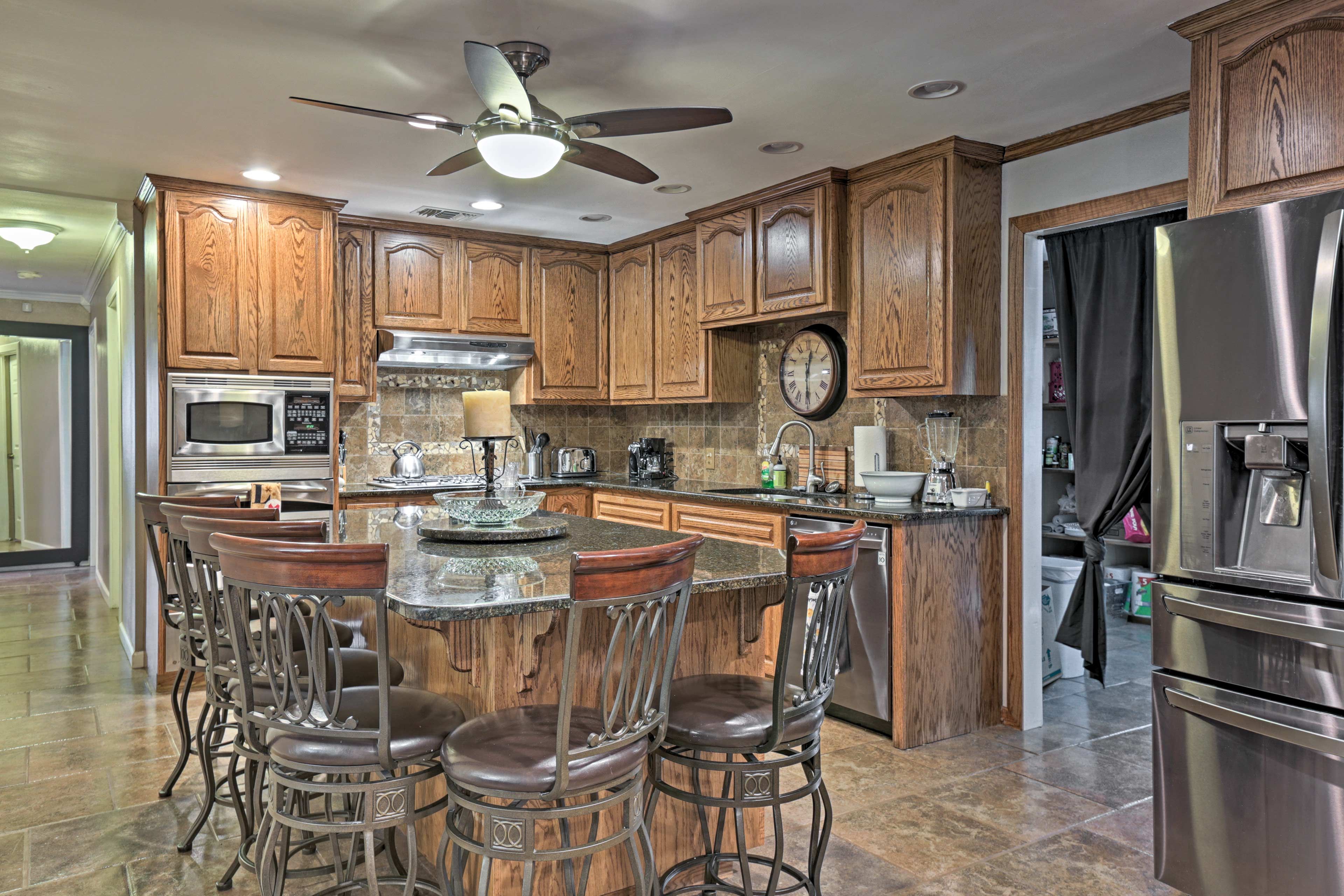 The fully equipped kitchen boasts stainless steel appliances.