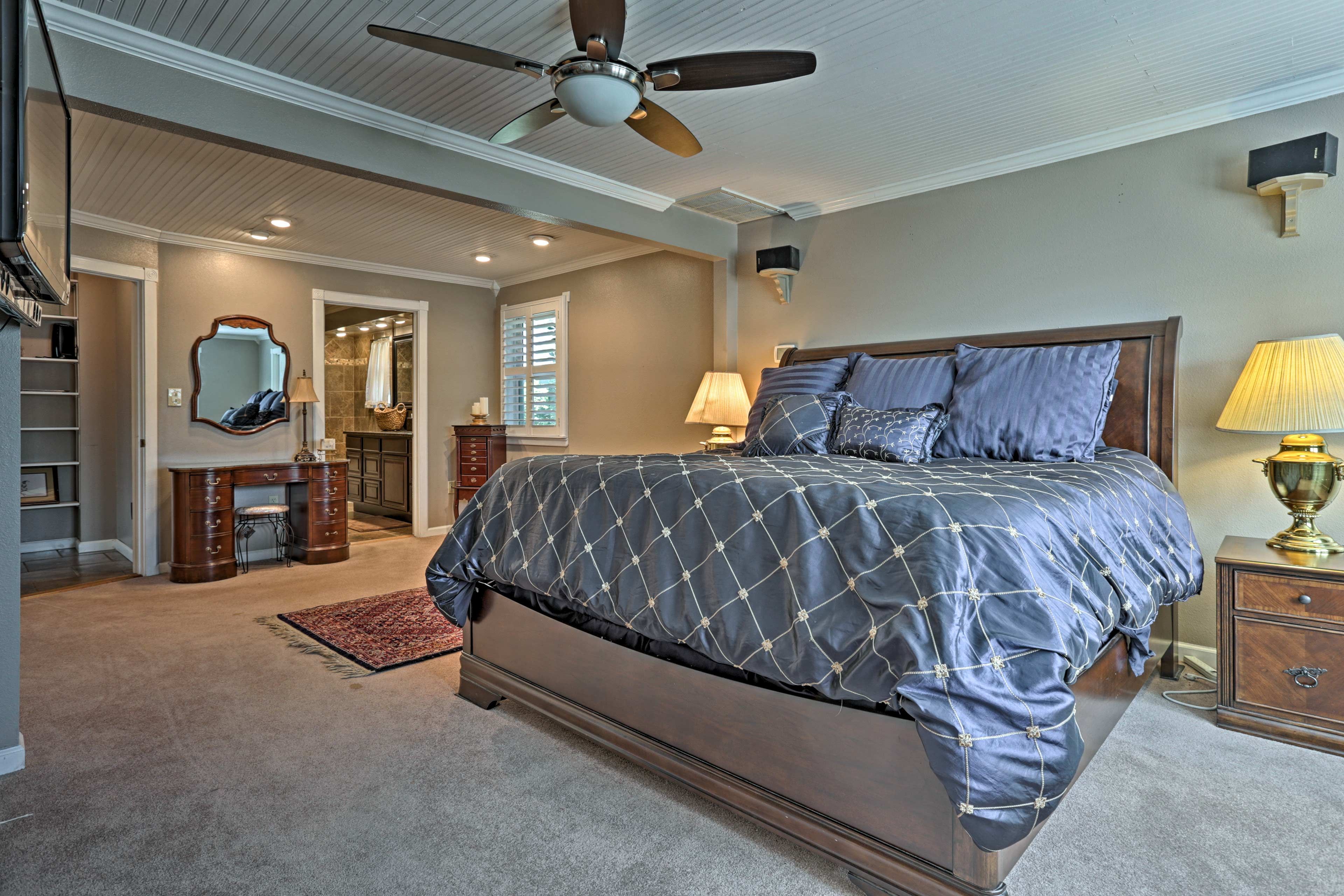 This bedroom boasts a plush king bed and a pristine en-suite bathroom.