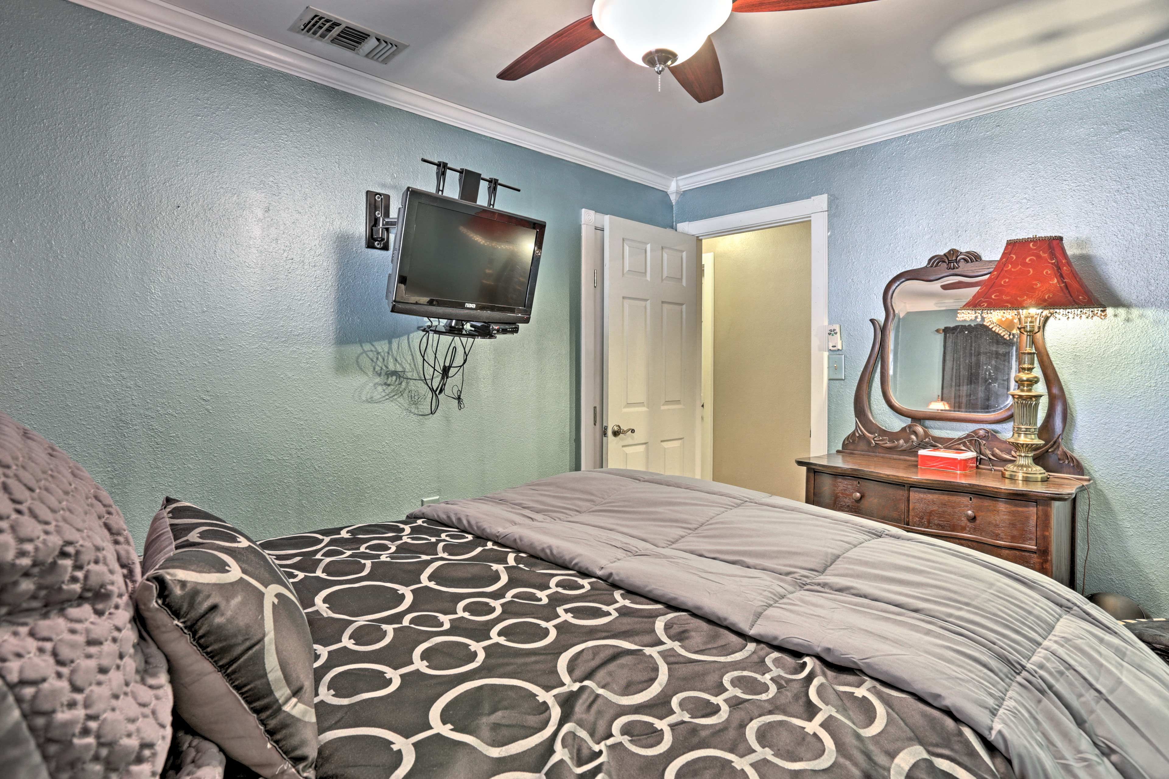 Doze off as a movie plays on the flat-screen cable TV.