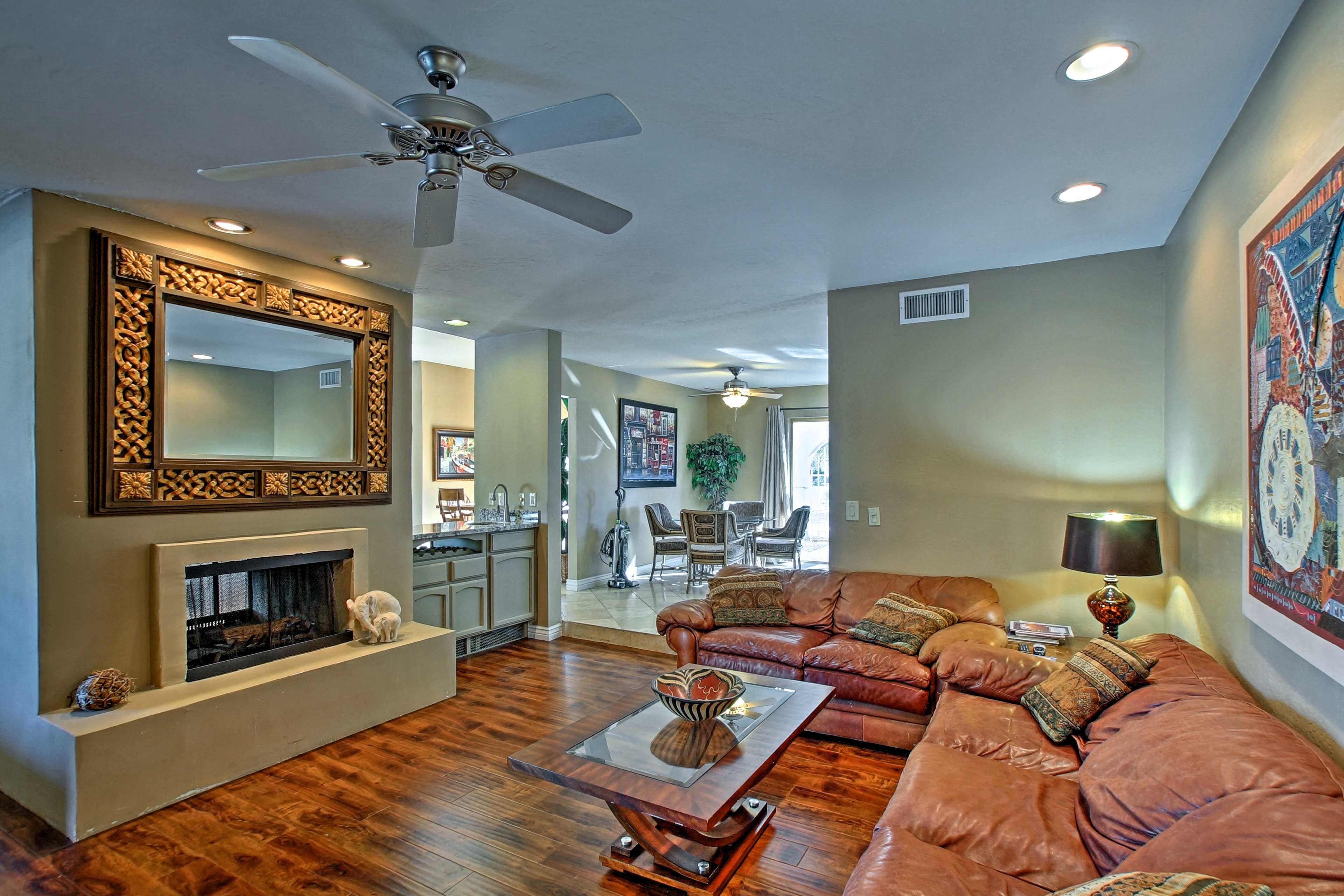Both of the living rooms offer cozy leather couches.