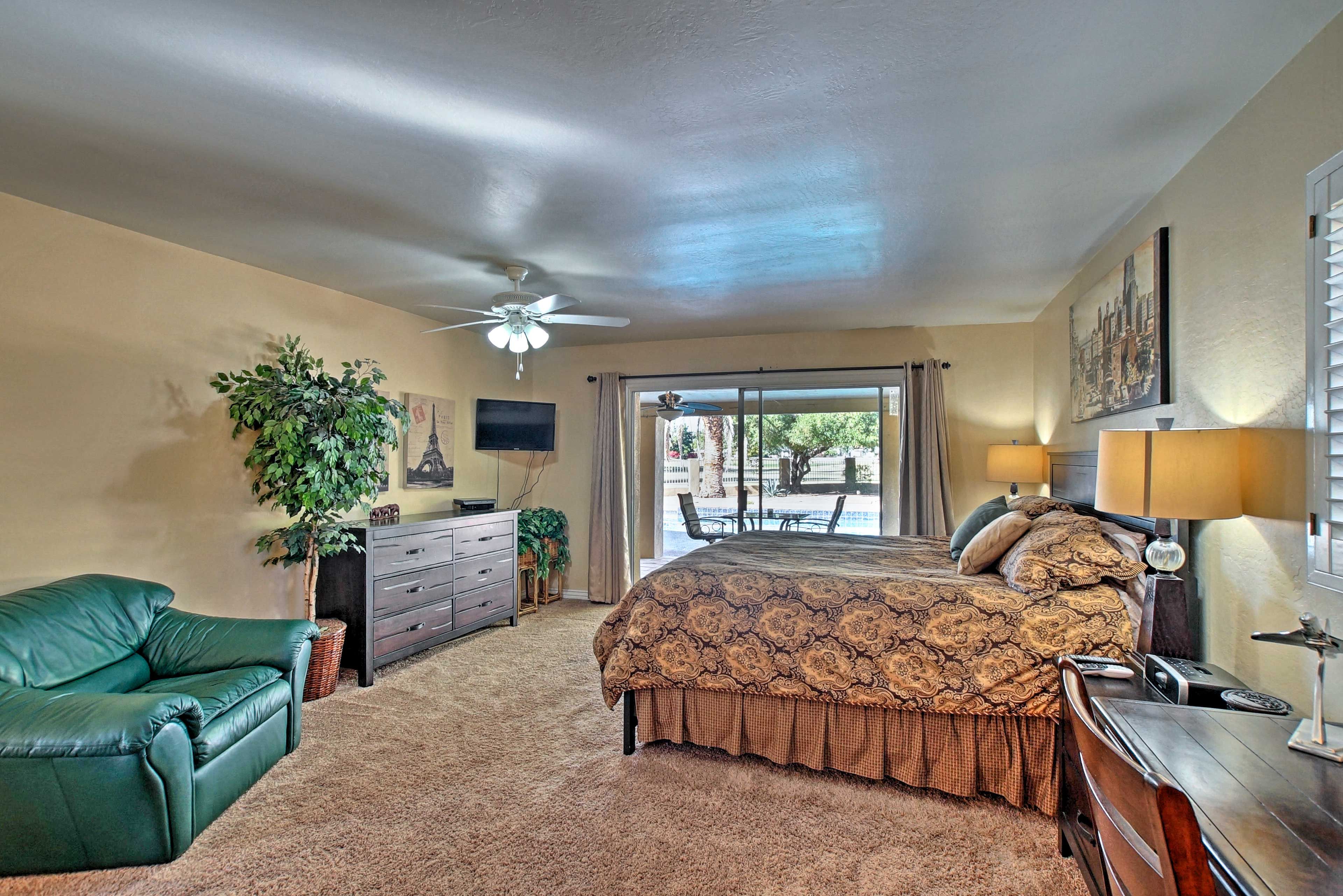 The first bedroom has access to the patio, king bed, and flat-screen cable TV.