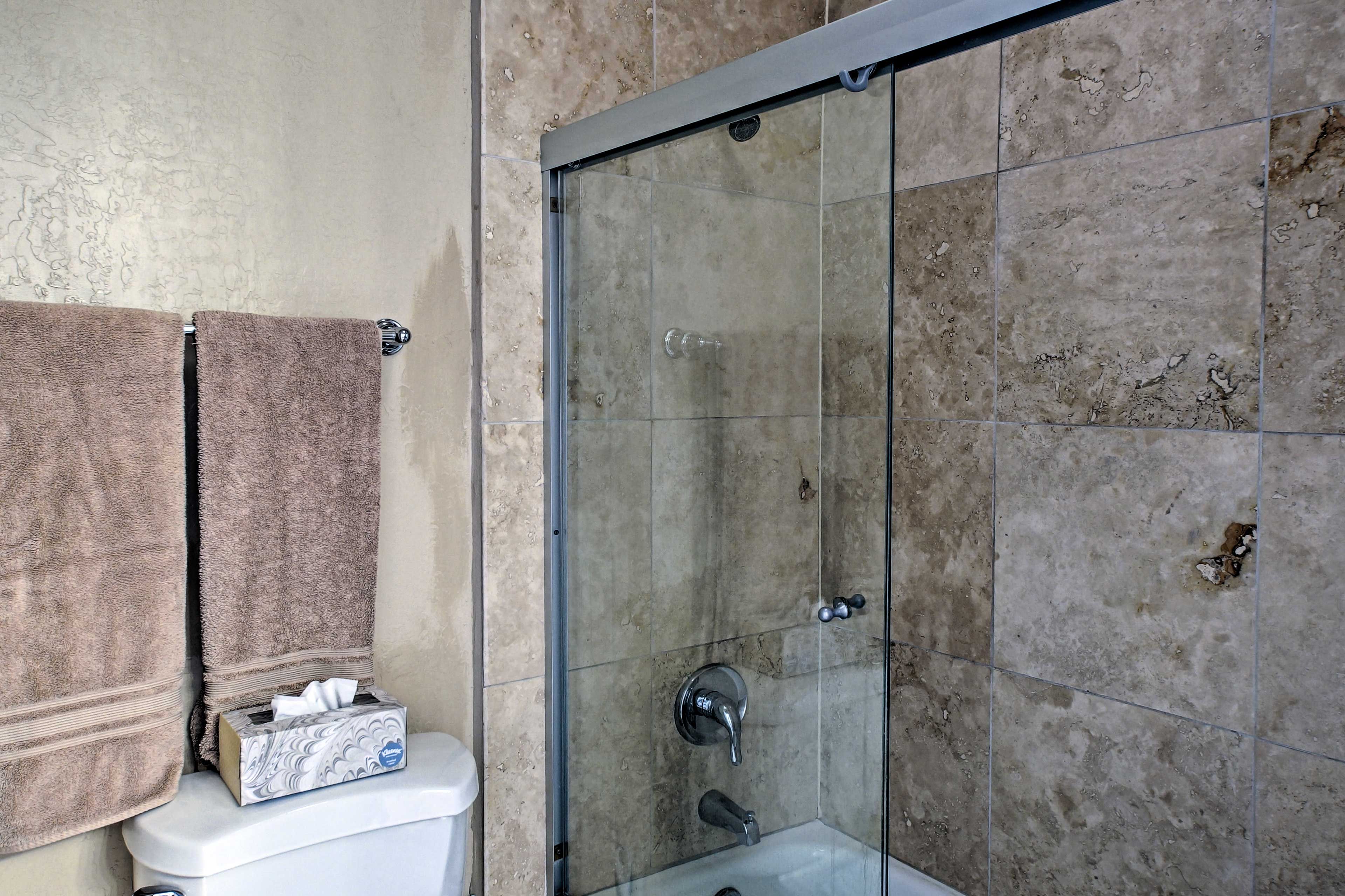 Rinse off in the beautiful, tile-lined, stand-up shower in the second bathroom.