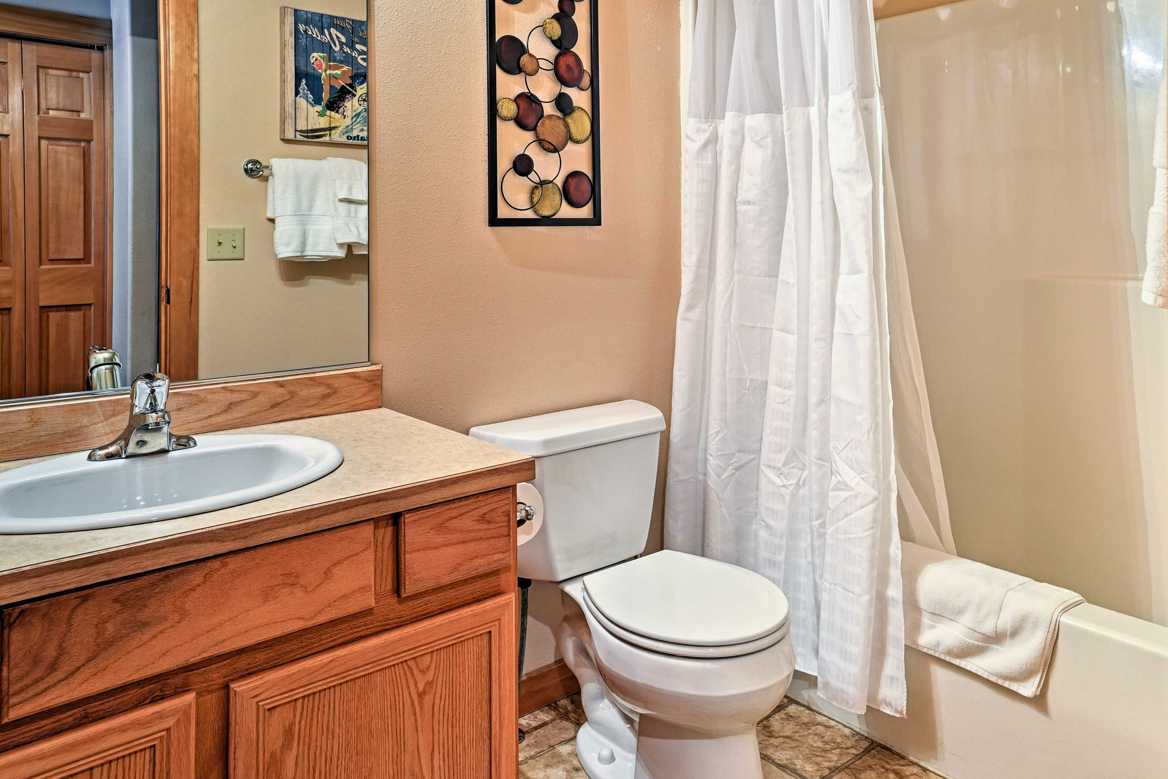 Shower off in one of the bathrooms stocked with fresh towels.