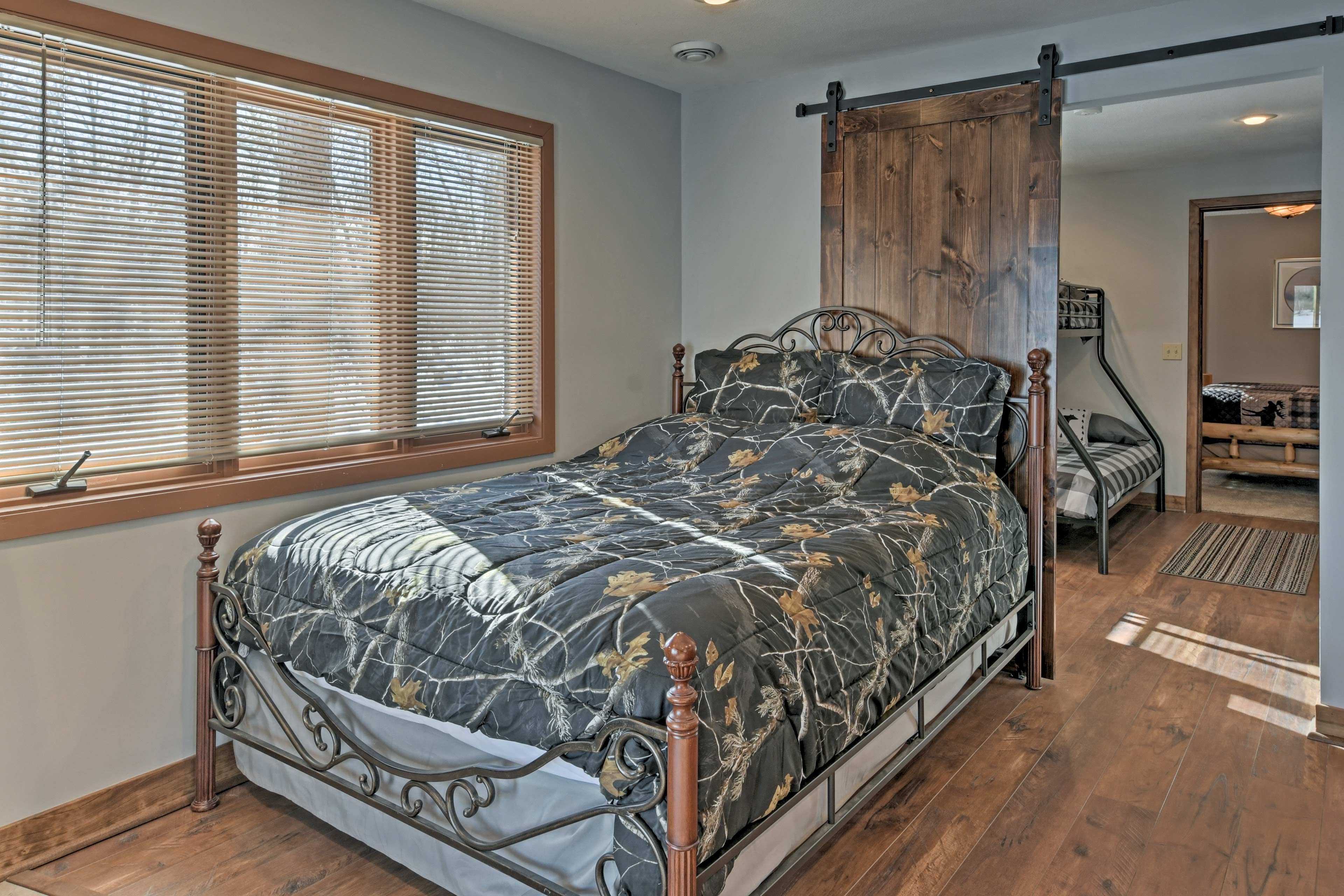 A queen bed can be found right off the basement.