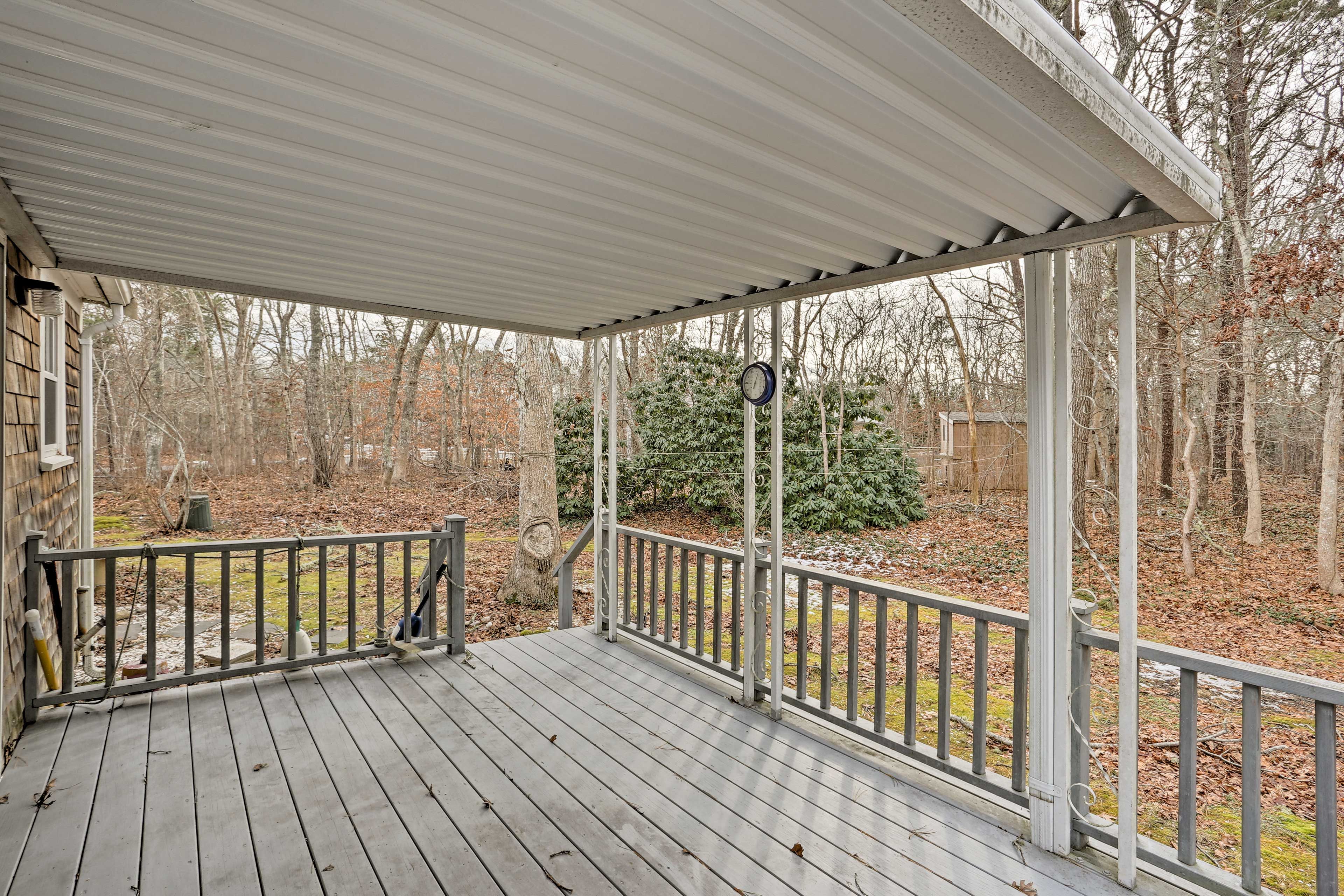 You'll love the tranquility of the covered deck and wooded views.