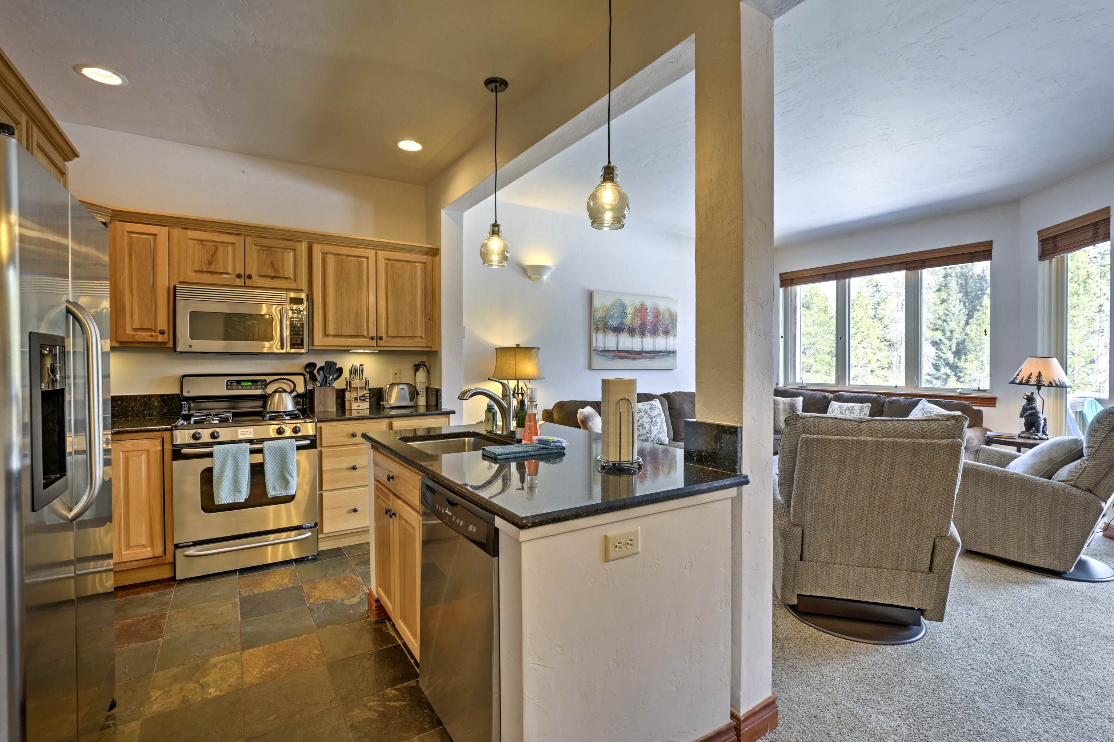 Serve appetizers at the breakfast bar and dinner around the wood dining table.