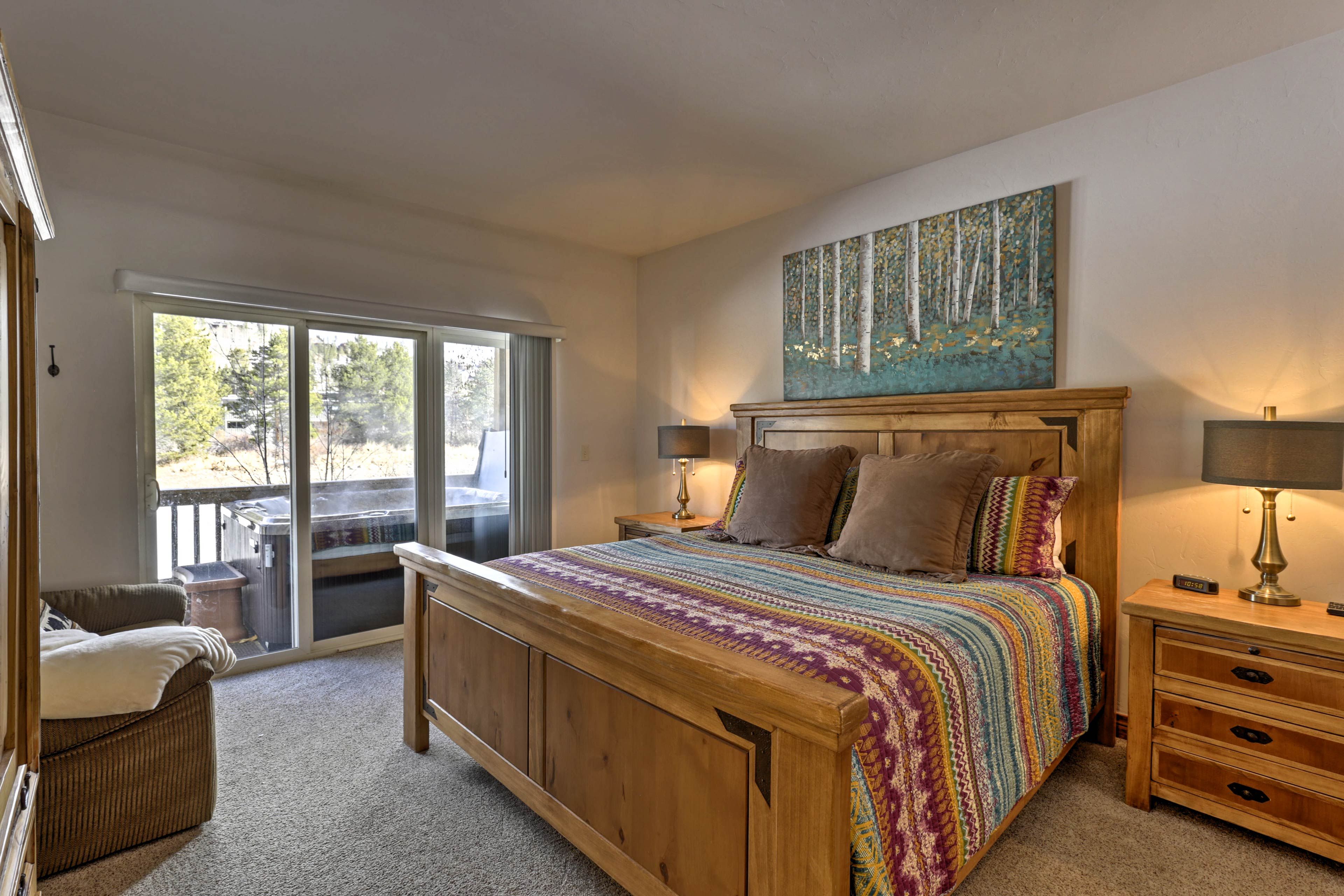 Easily access the walk-out patio and private hot tub from this basement bedroom!