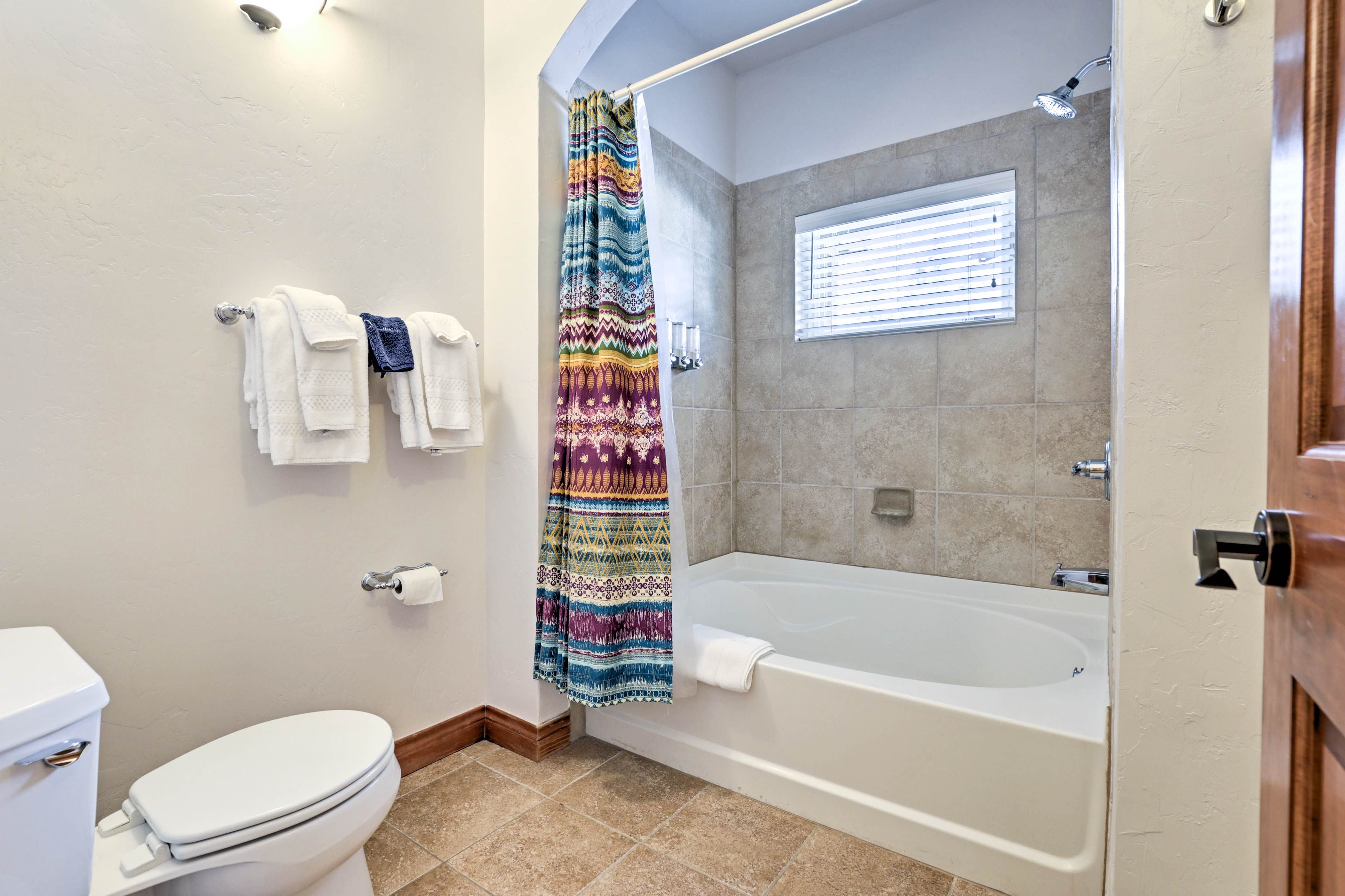 Enjoy a soothing soak or a refreshing rinse in this tub/shower combo.