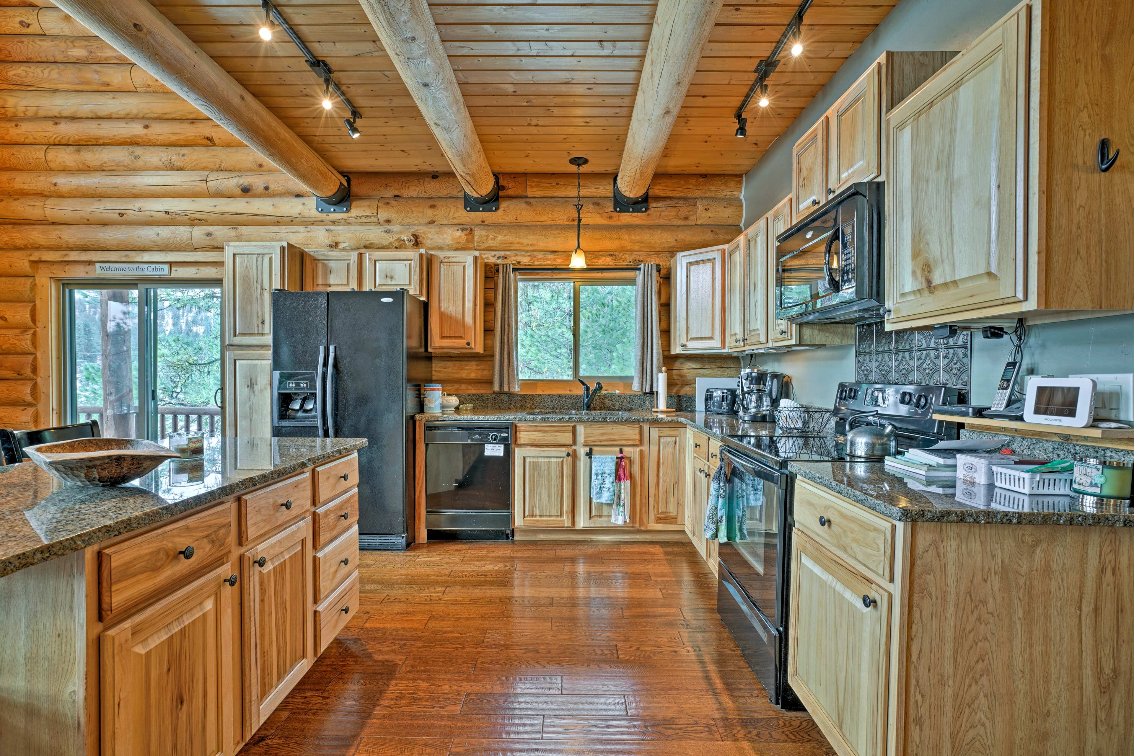 The spacious kitchen is fully equipped for preparing all your favorite meals.