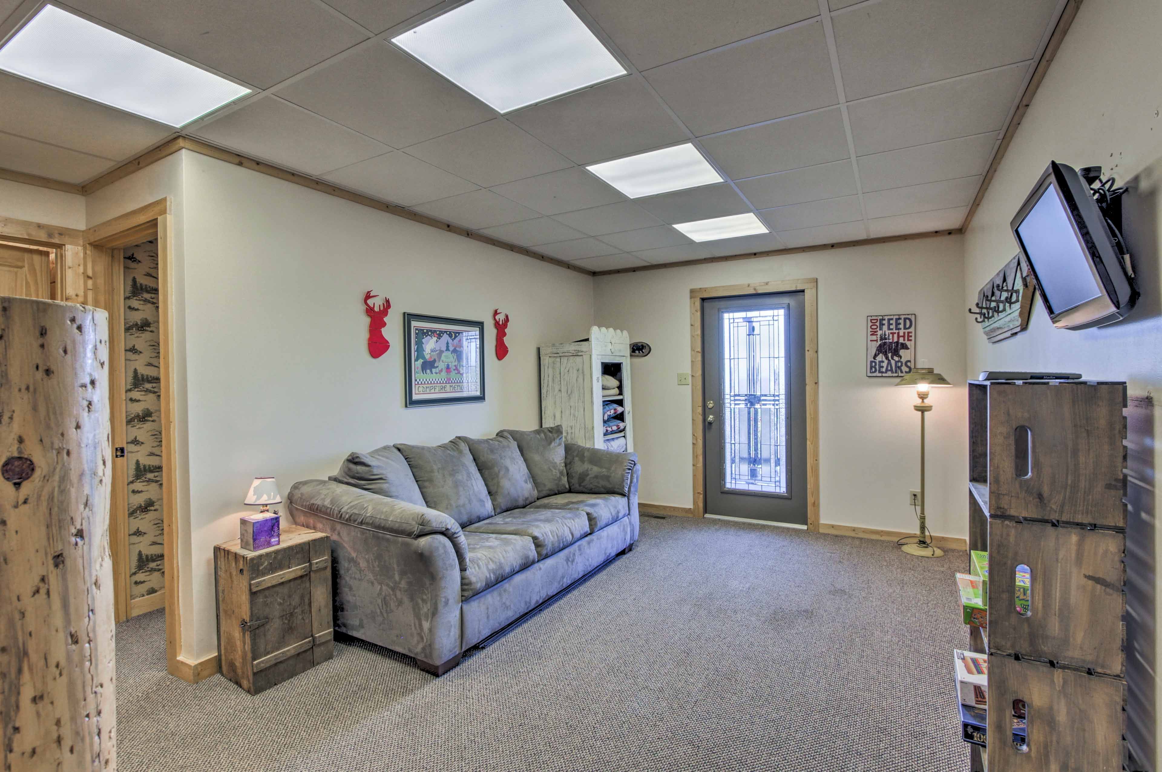 The downstairs game room has a flat-screen TV with a DVD player.