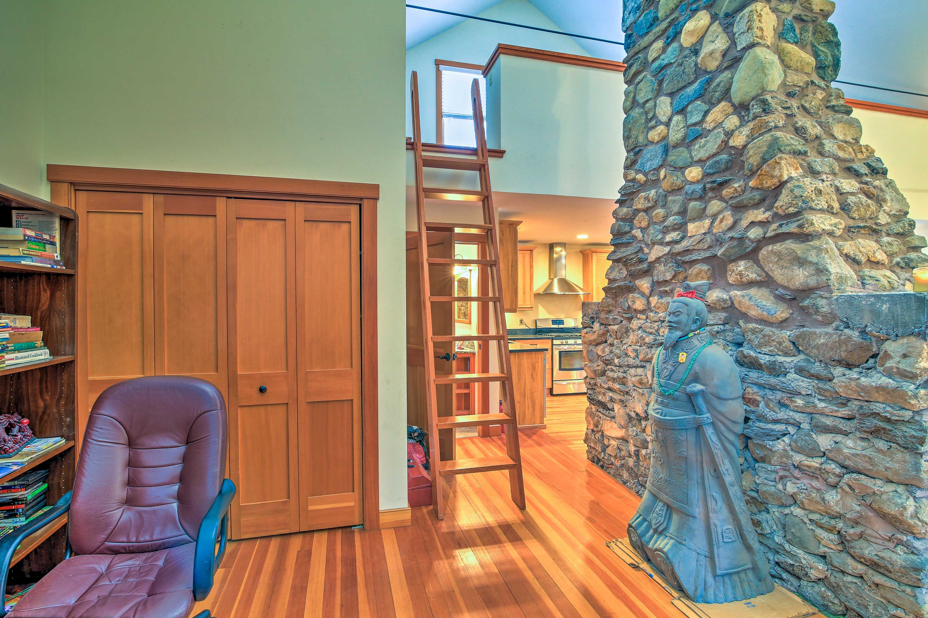 A wooden ladder leads to the private loft.