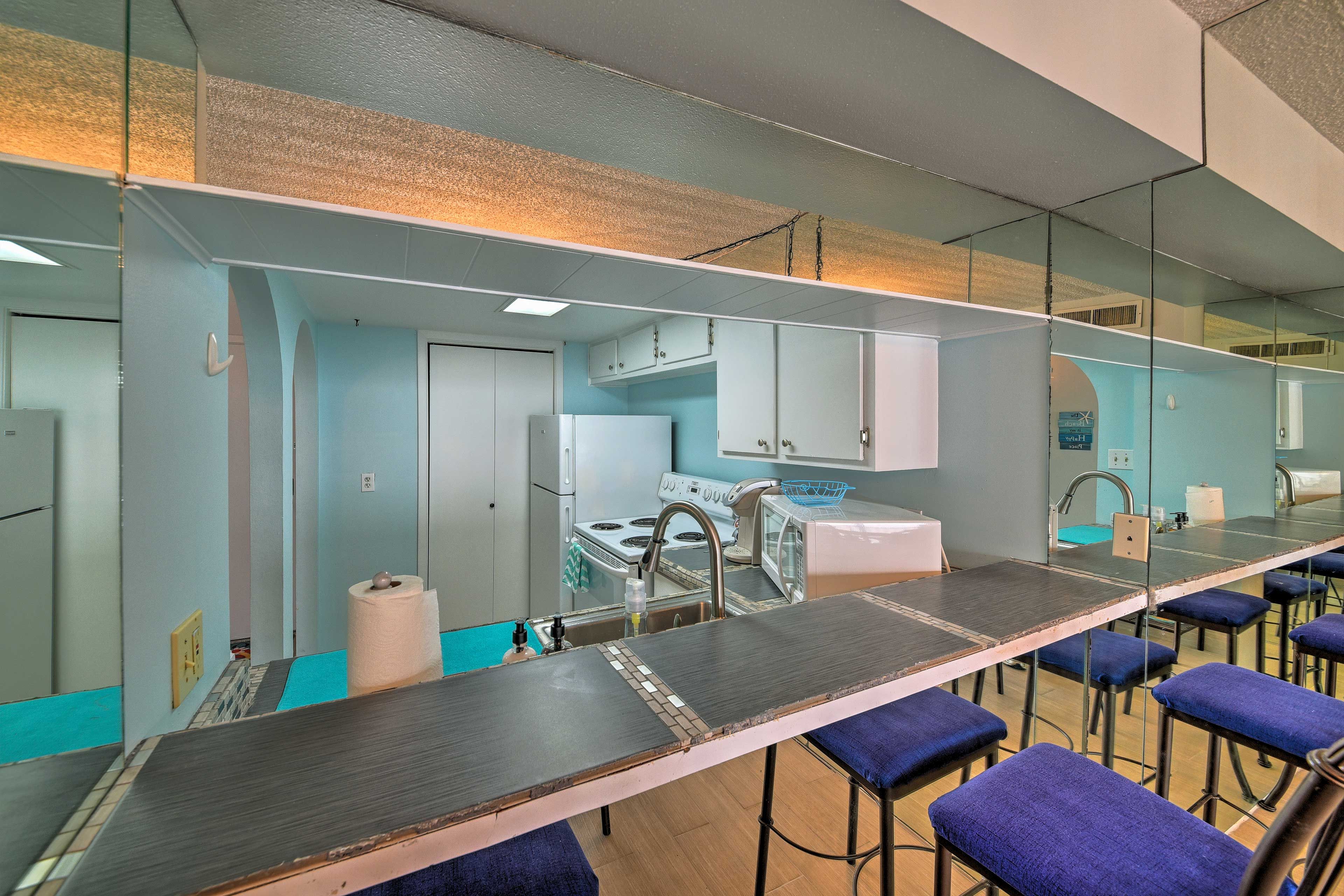Grab a quick bite to eat at the dining bar set for 3.