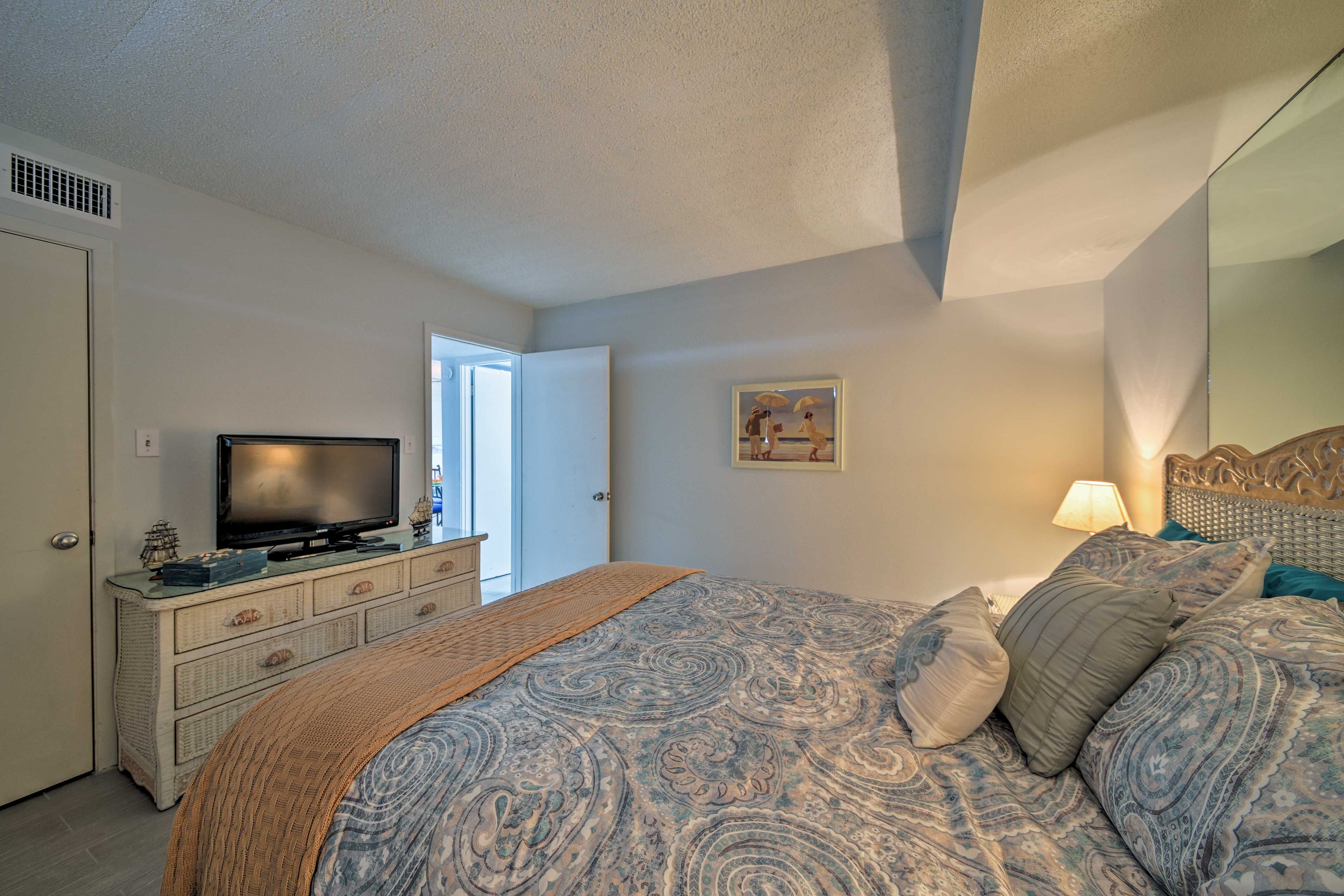 Watch a show before drifting off to dreamland in the queen bed.