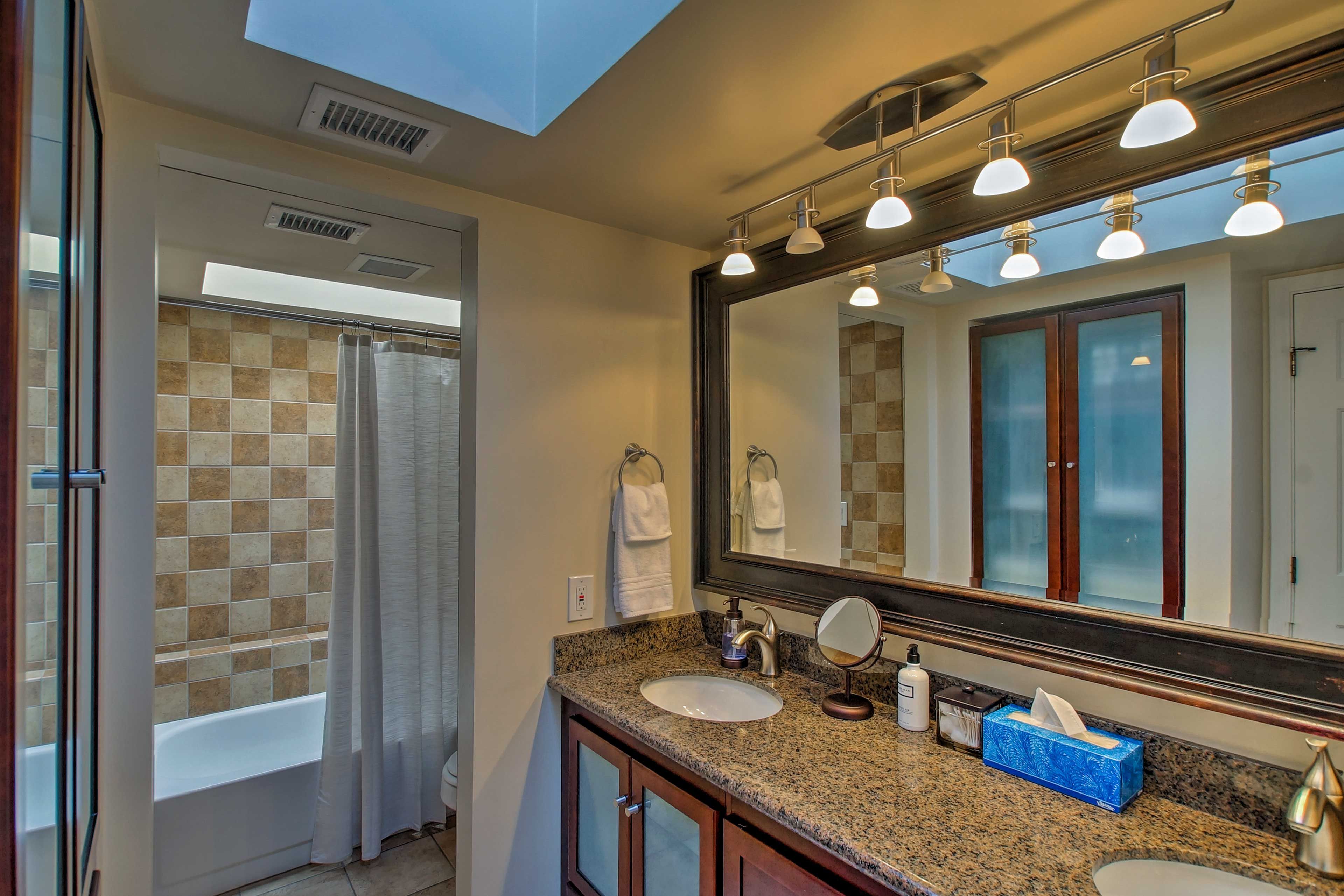 This Jack-and-Jill style bathroom is shared between the 2 bedrooms.