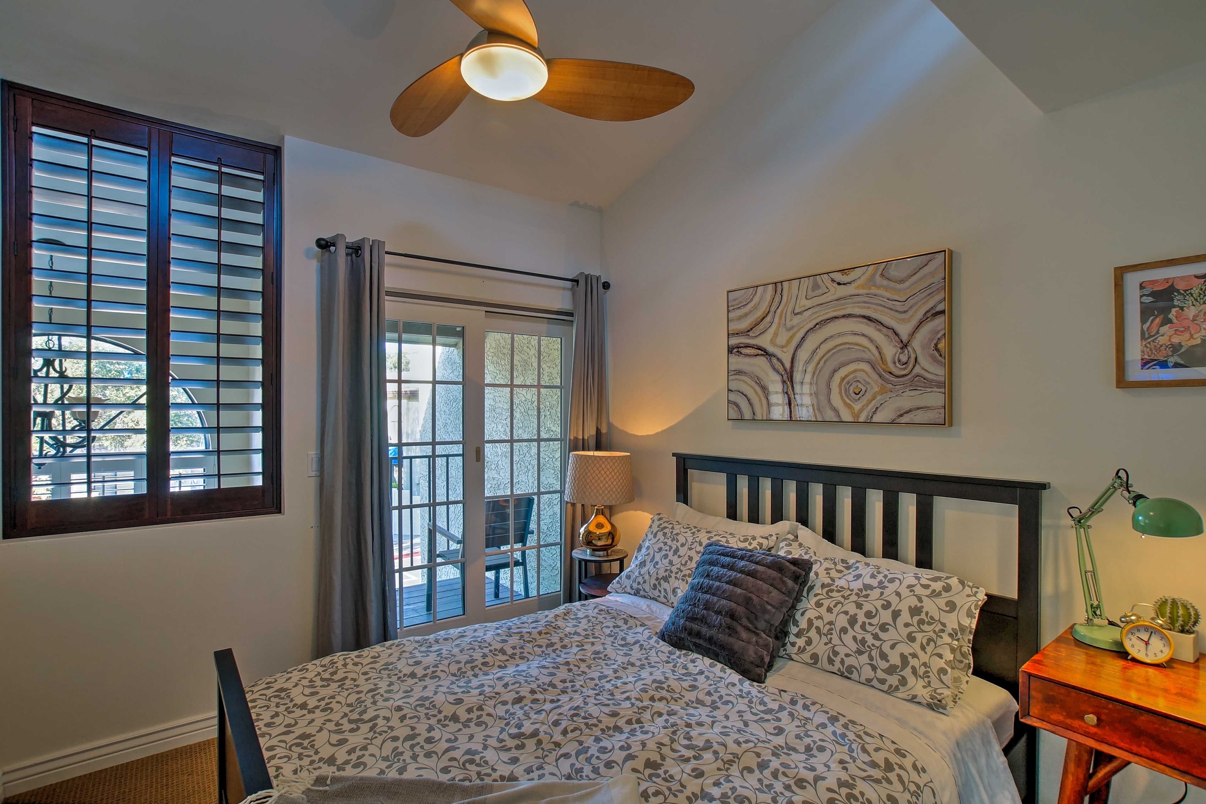 The second bedroom houses a queen-sized bed.