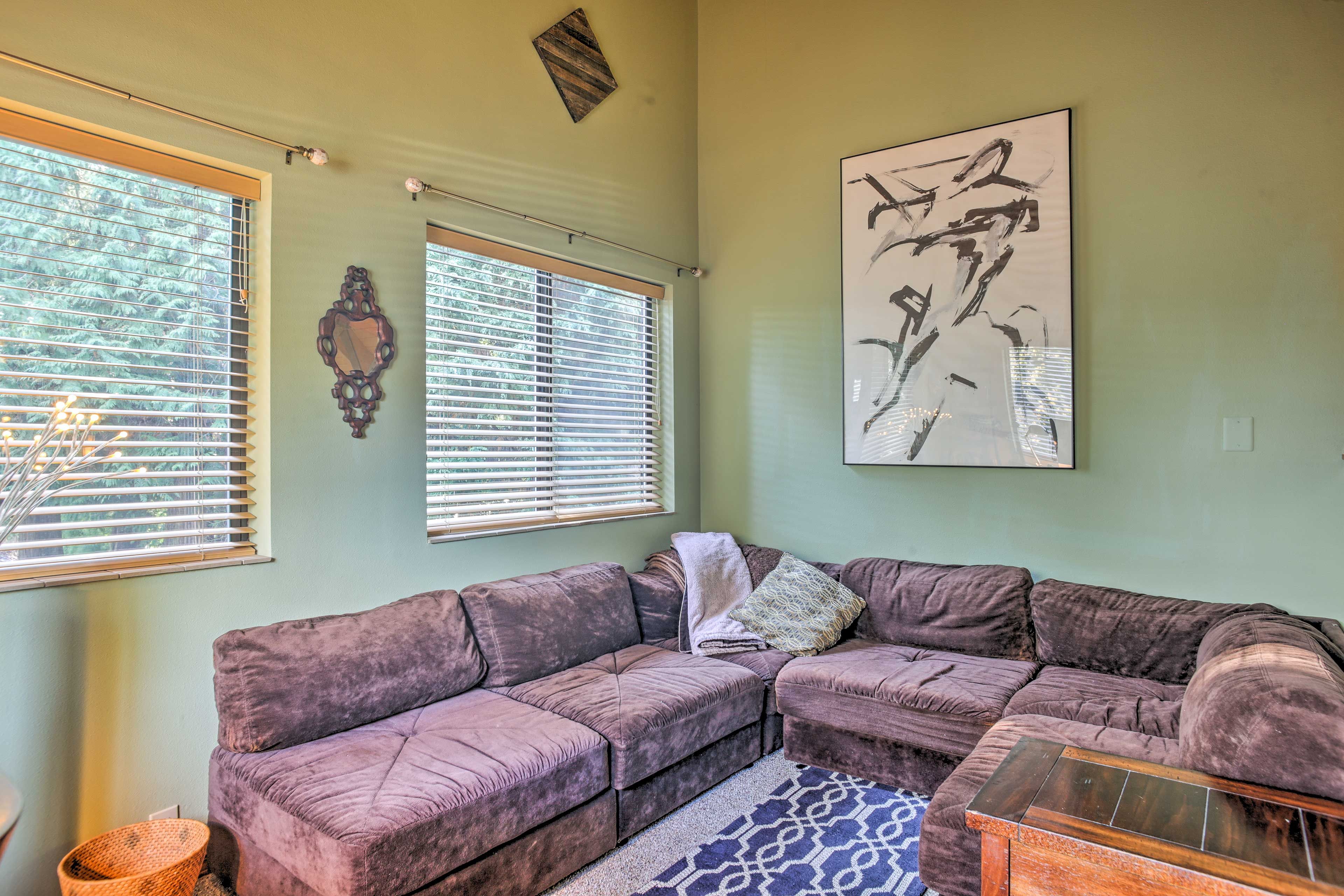 Sharing the space is a comfy modular couch that converts to a queen bed.