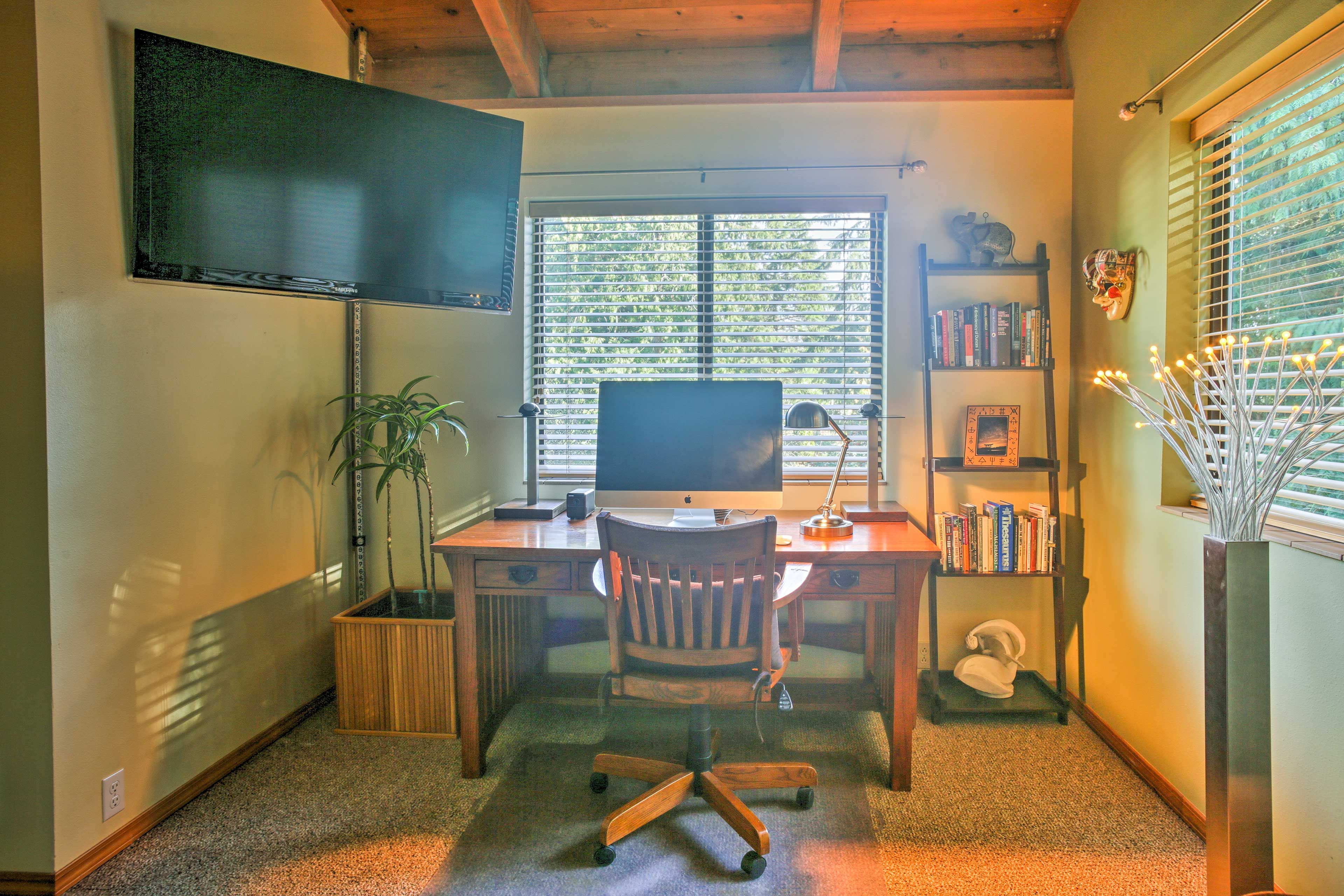 Watch the flat-screen Smart TV or catch up on work at the desktop computer.