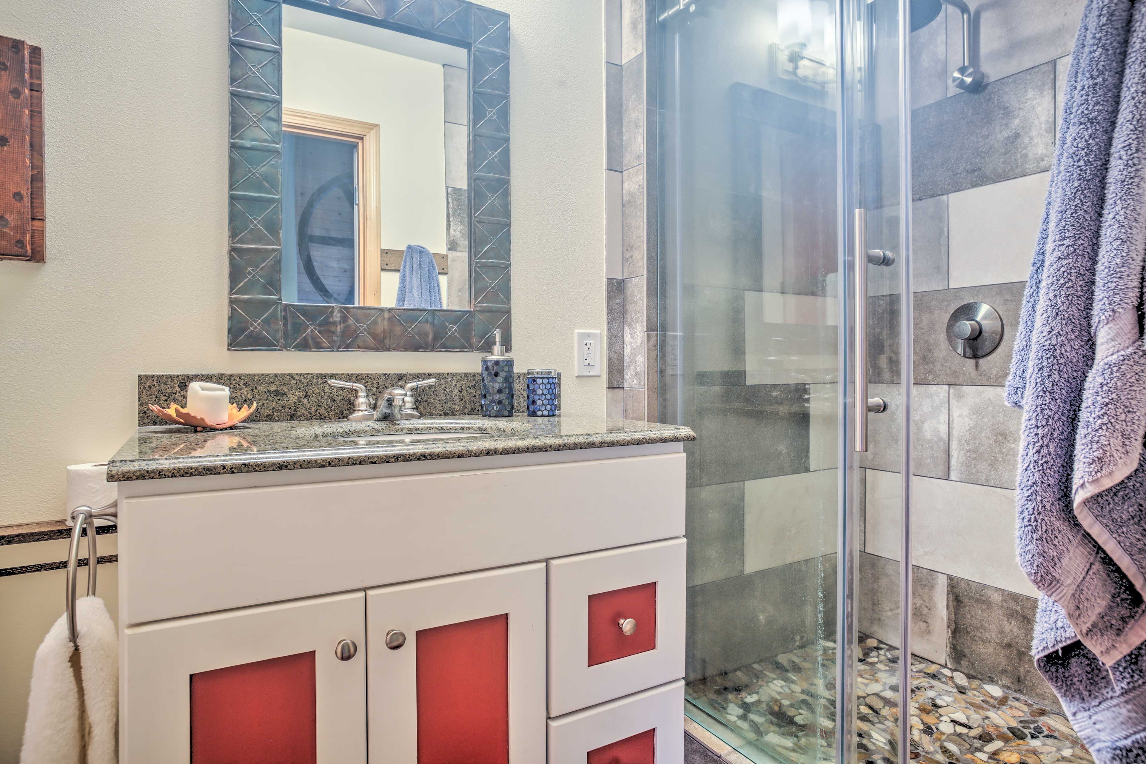 The en-suite upstairs bathroom plays host to a walk-in shower.
