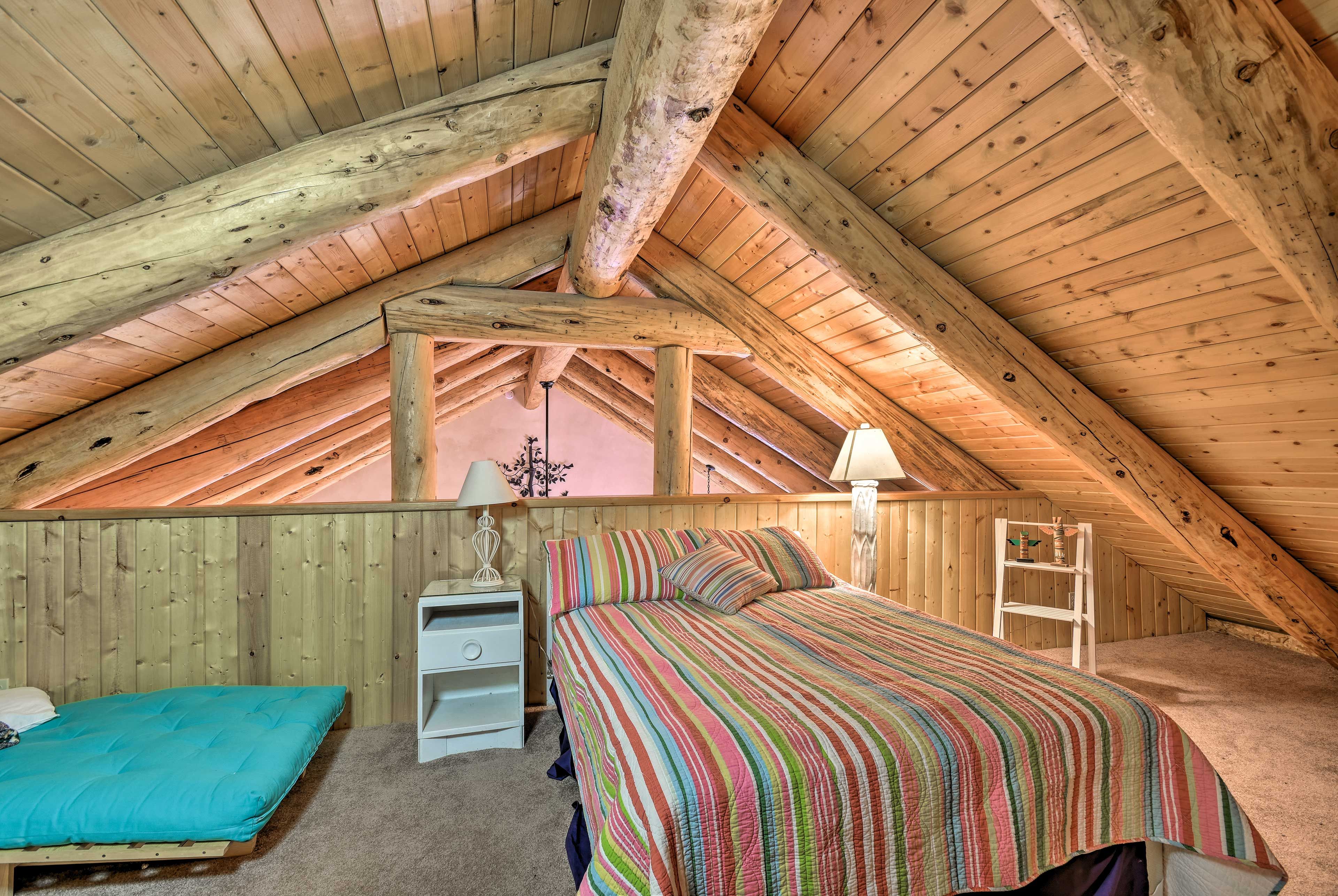 You'll find a full bed next to a single-size futon.