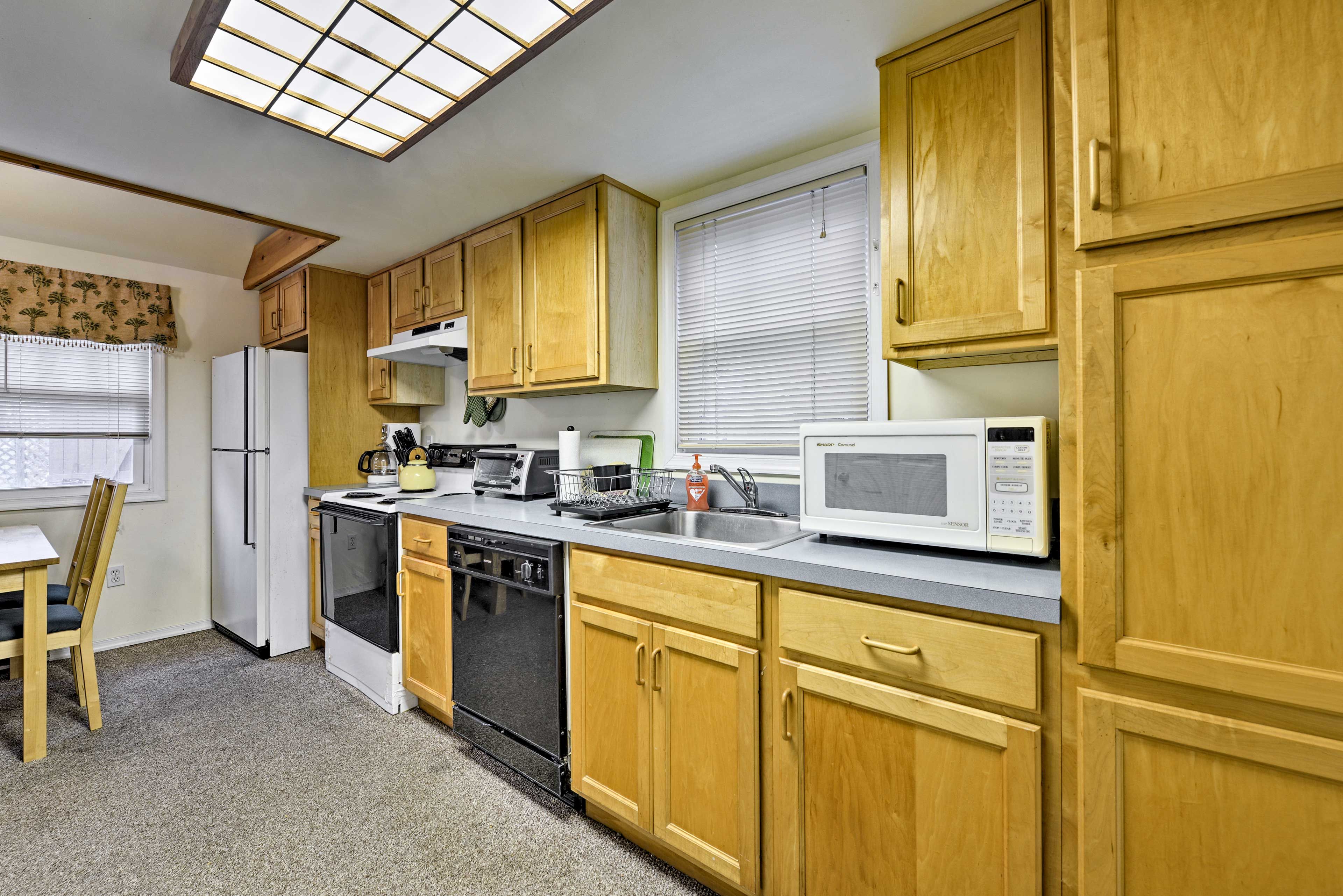 Modern appliances including an oven and dishwasher make home-cooking a breeze.