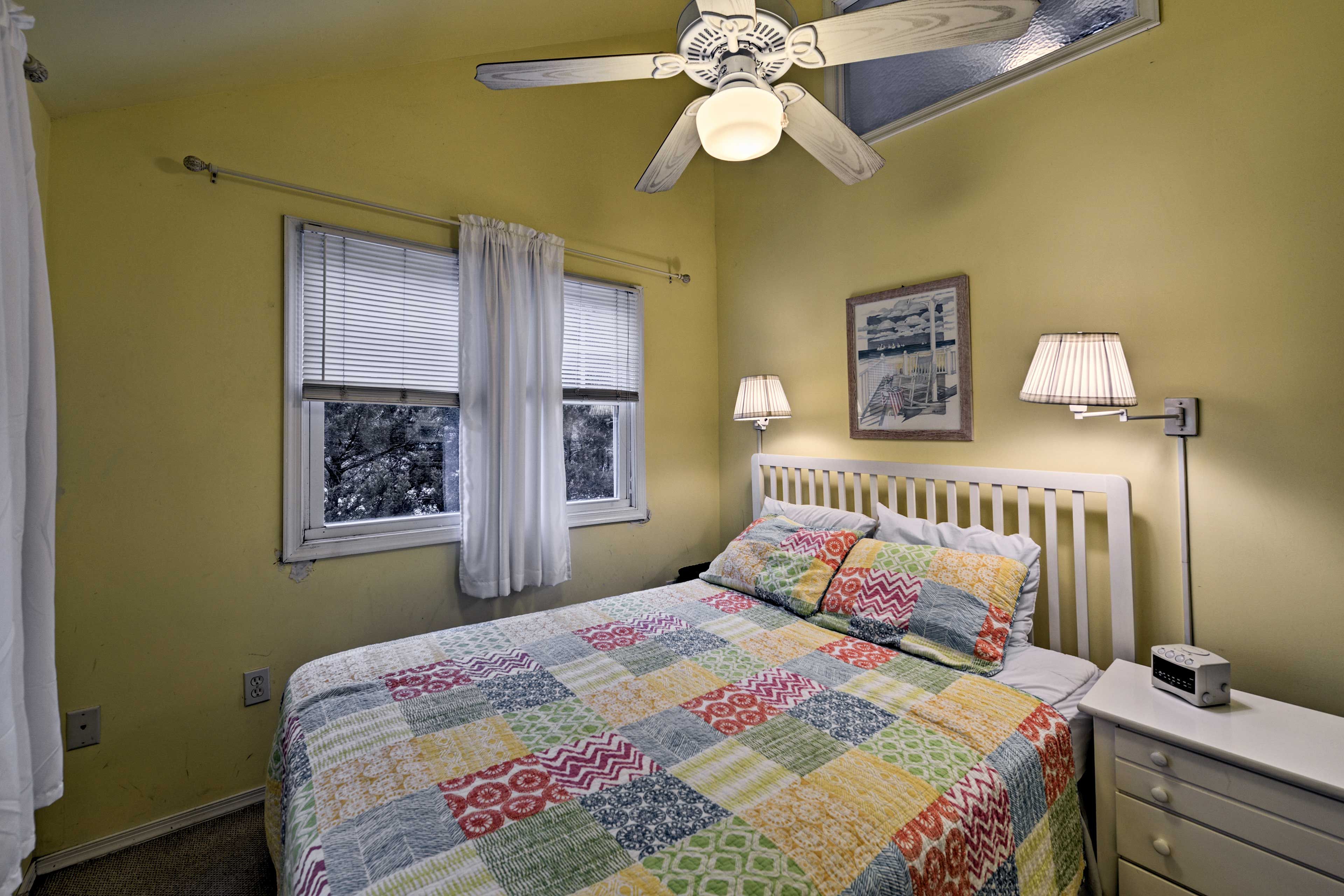Rest and recuperate in the bedroom with a queen-sized bed.