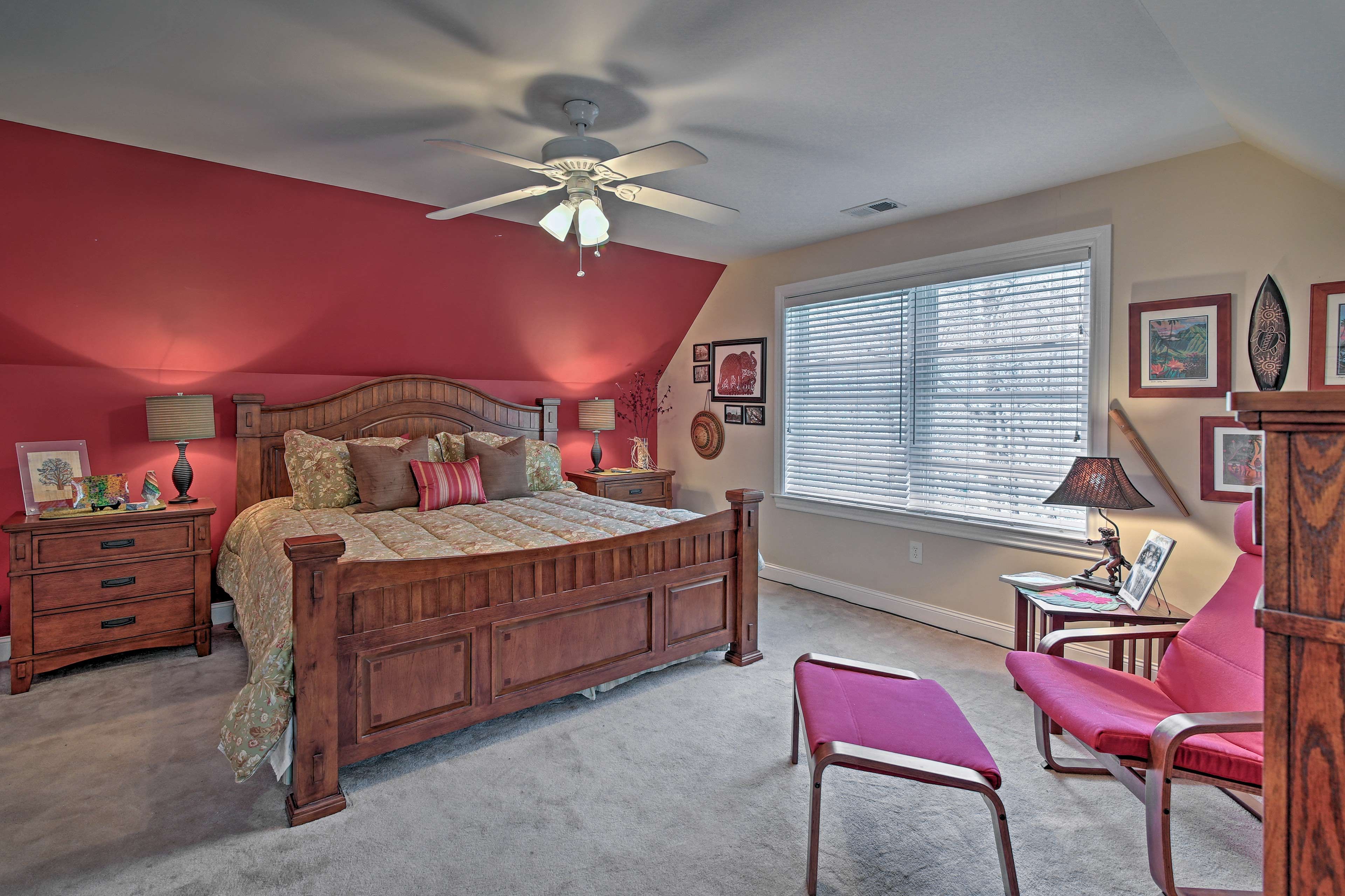 The master suite features a plush king-sized bed.