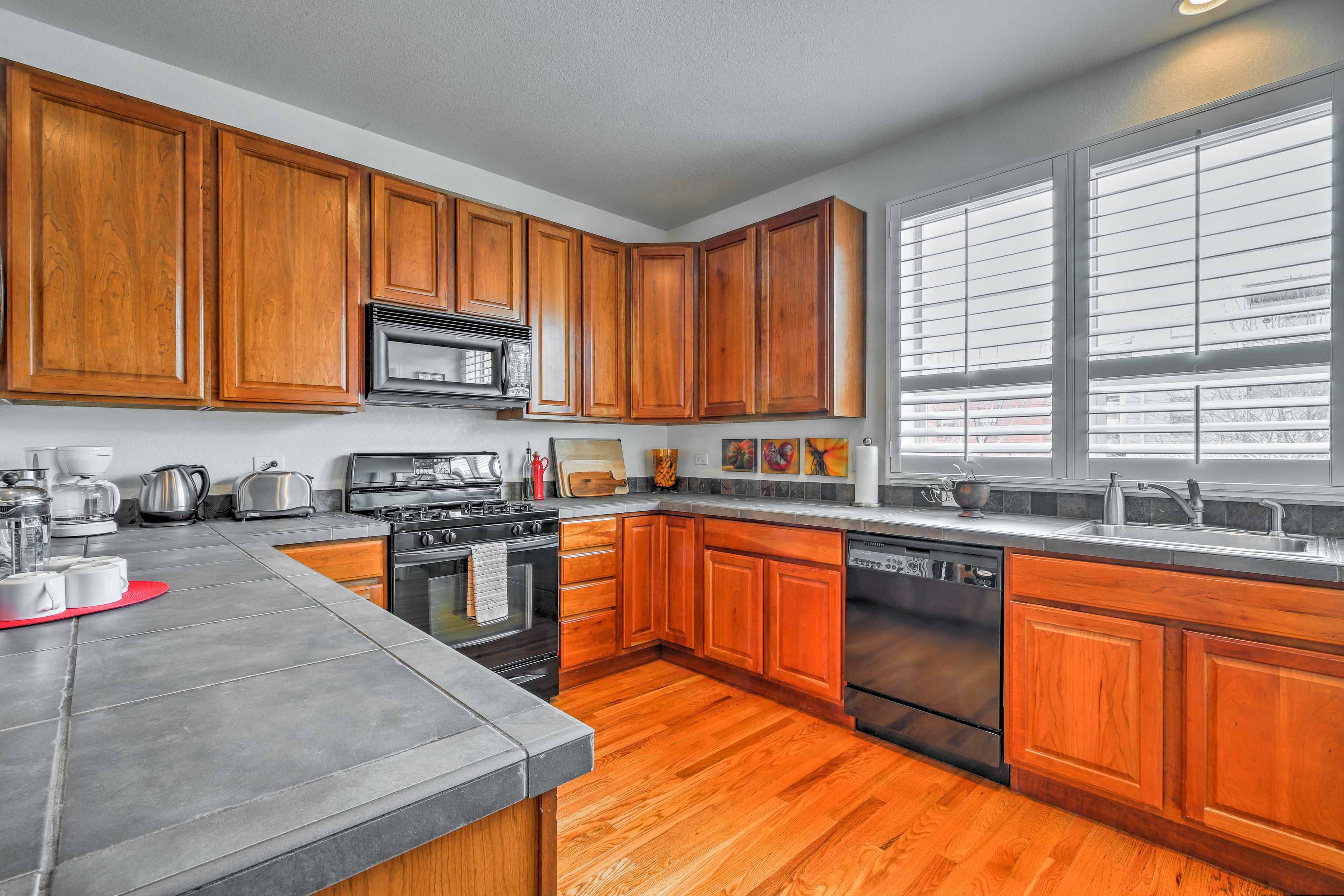 The kitchen is fully equipped with updated appliances.