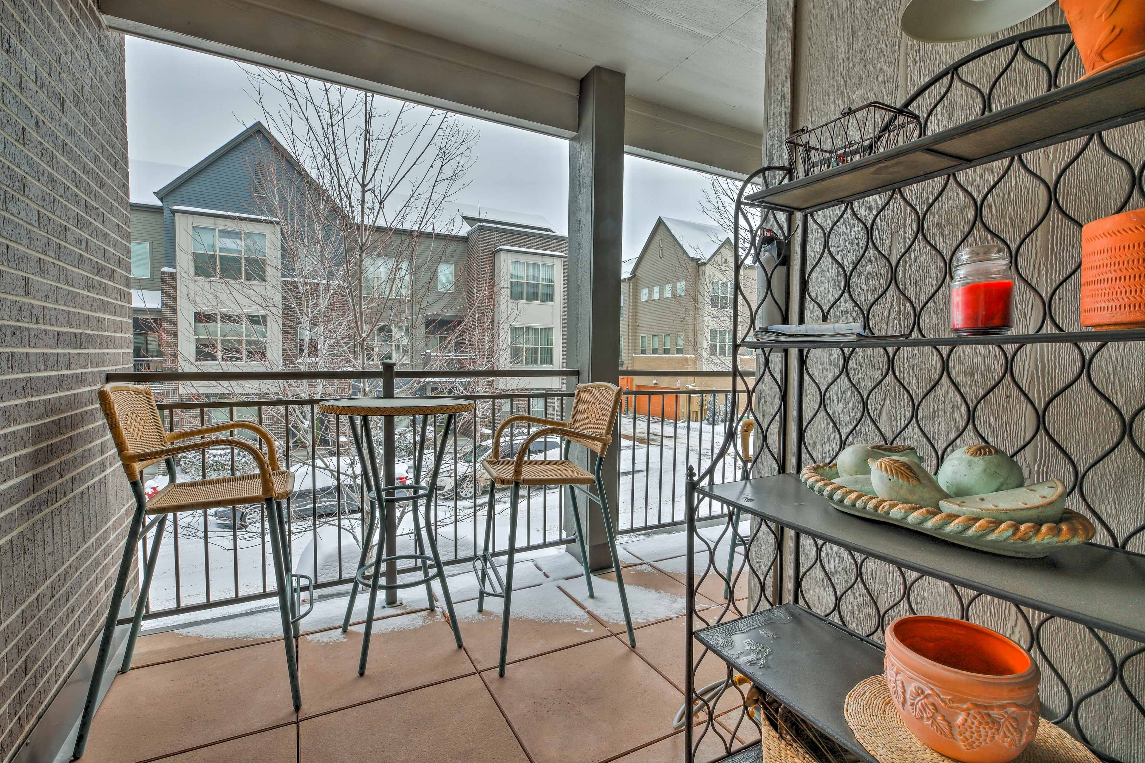 Bring a bottle of wine outside to the 2-person table on the balcony!
